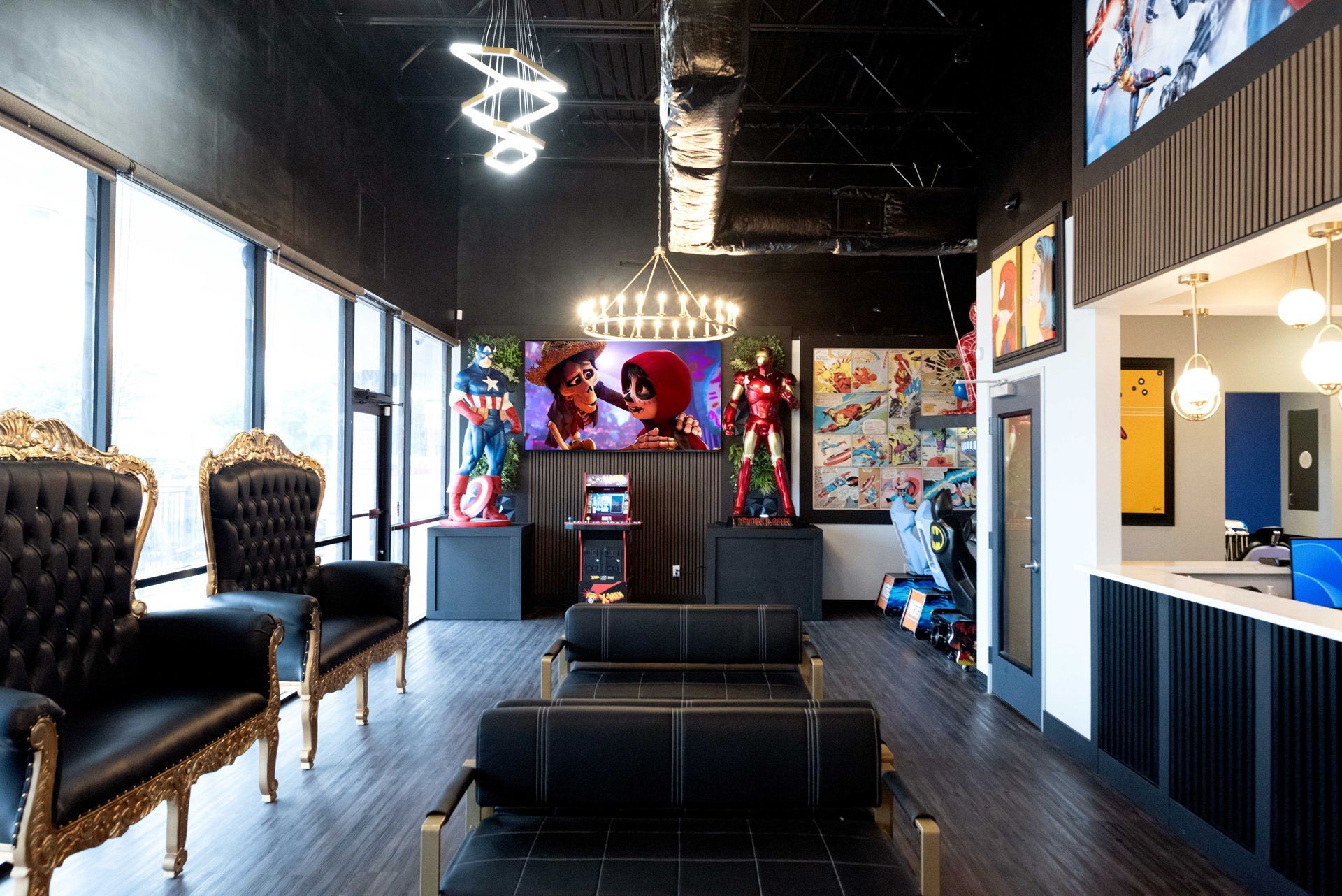 Modern lounge interior with black chairs, neon ceiling lights, and colorful wall art
