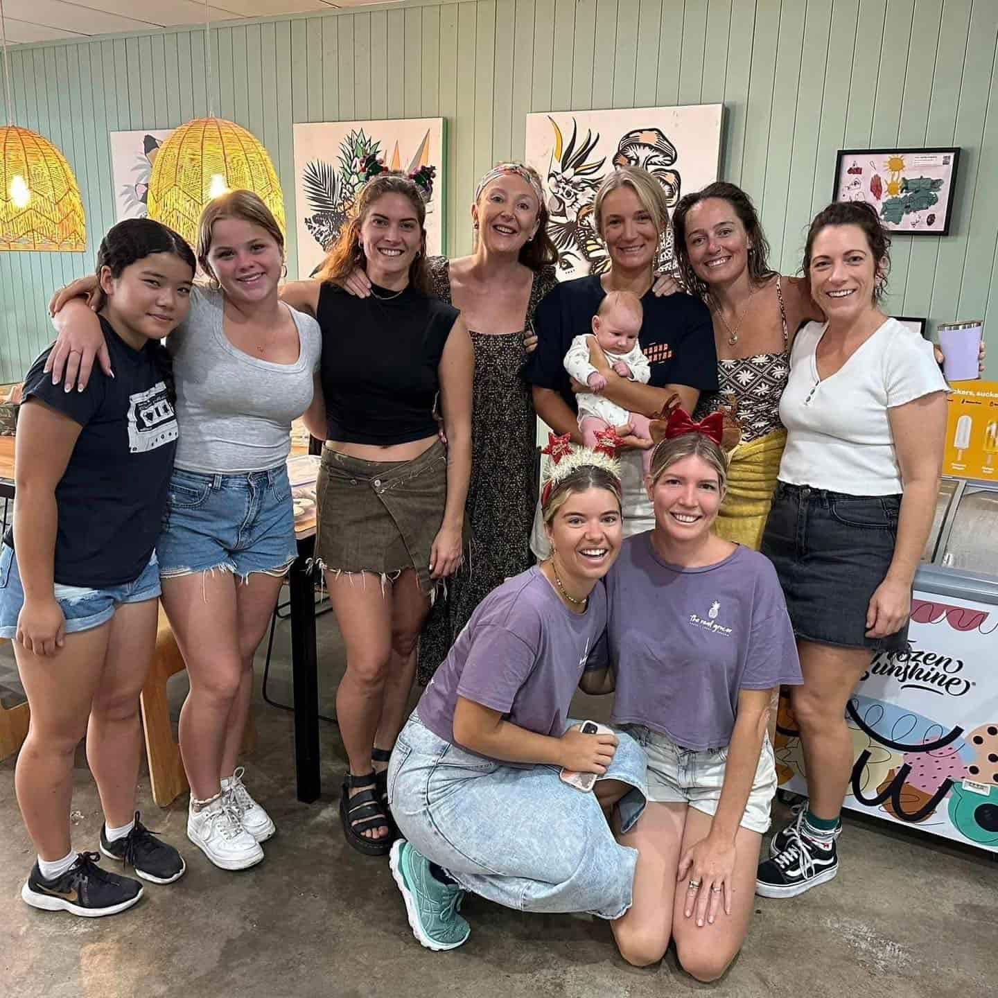 A Group Of Women Are Posing For A Picture In A Room — The Real Grocer In Golden Beach, QLD