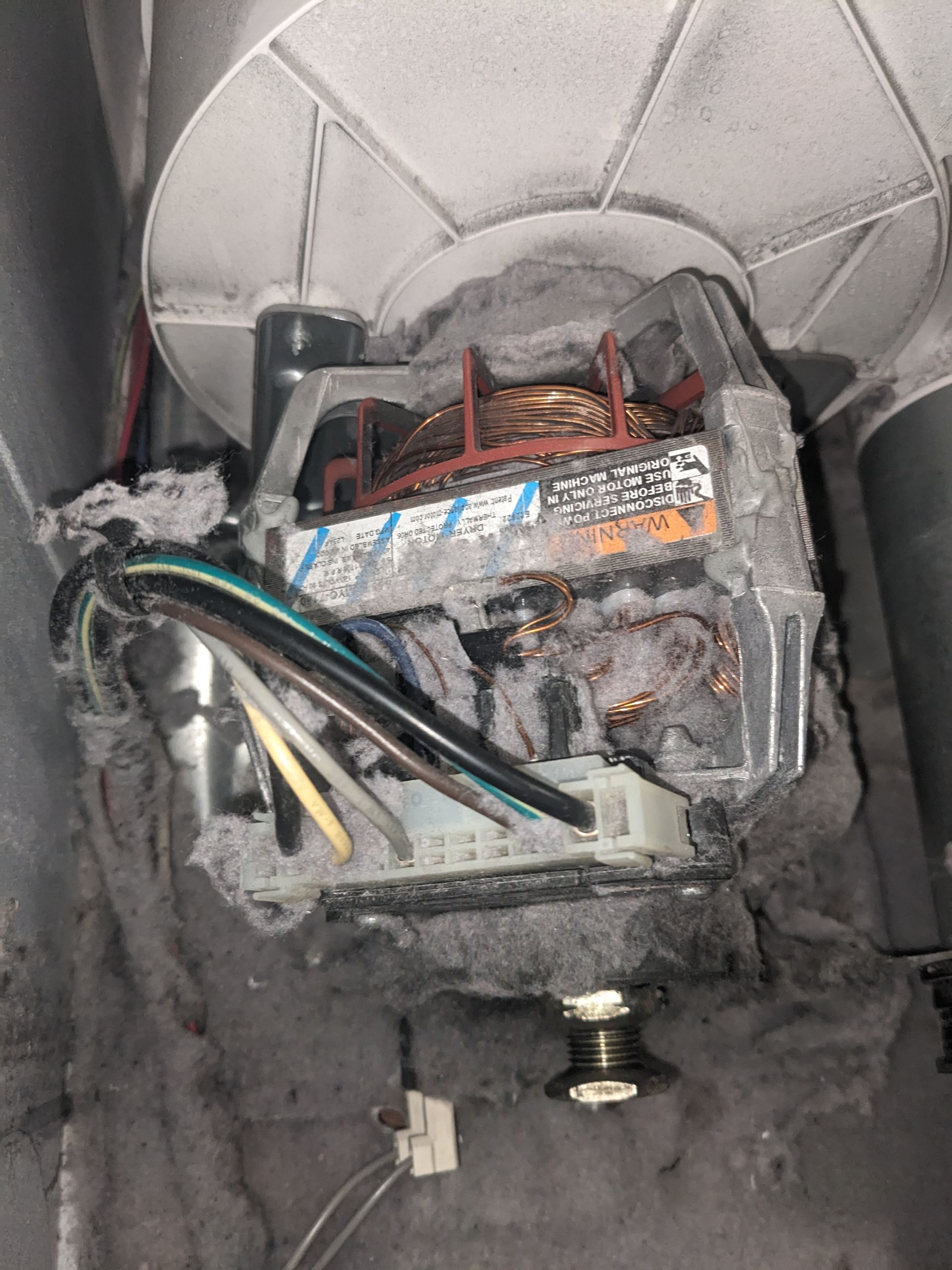 Corroded electrical switch box with exposed wires and burnt insulation inside a wall opening