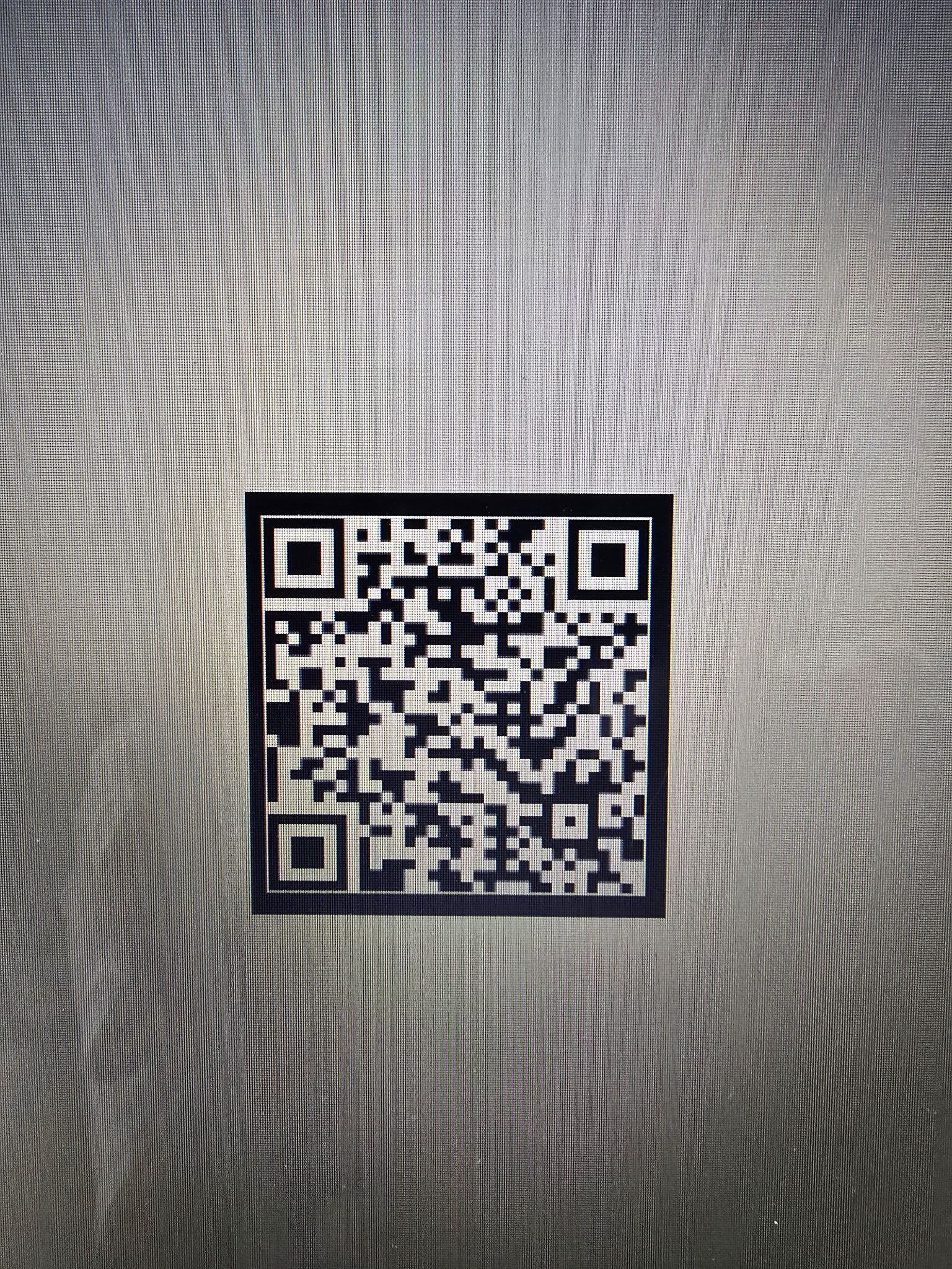 QR code centered on a gray patterned background
