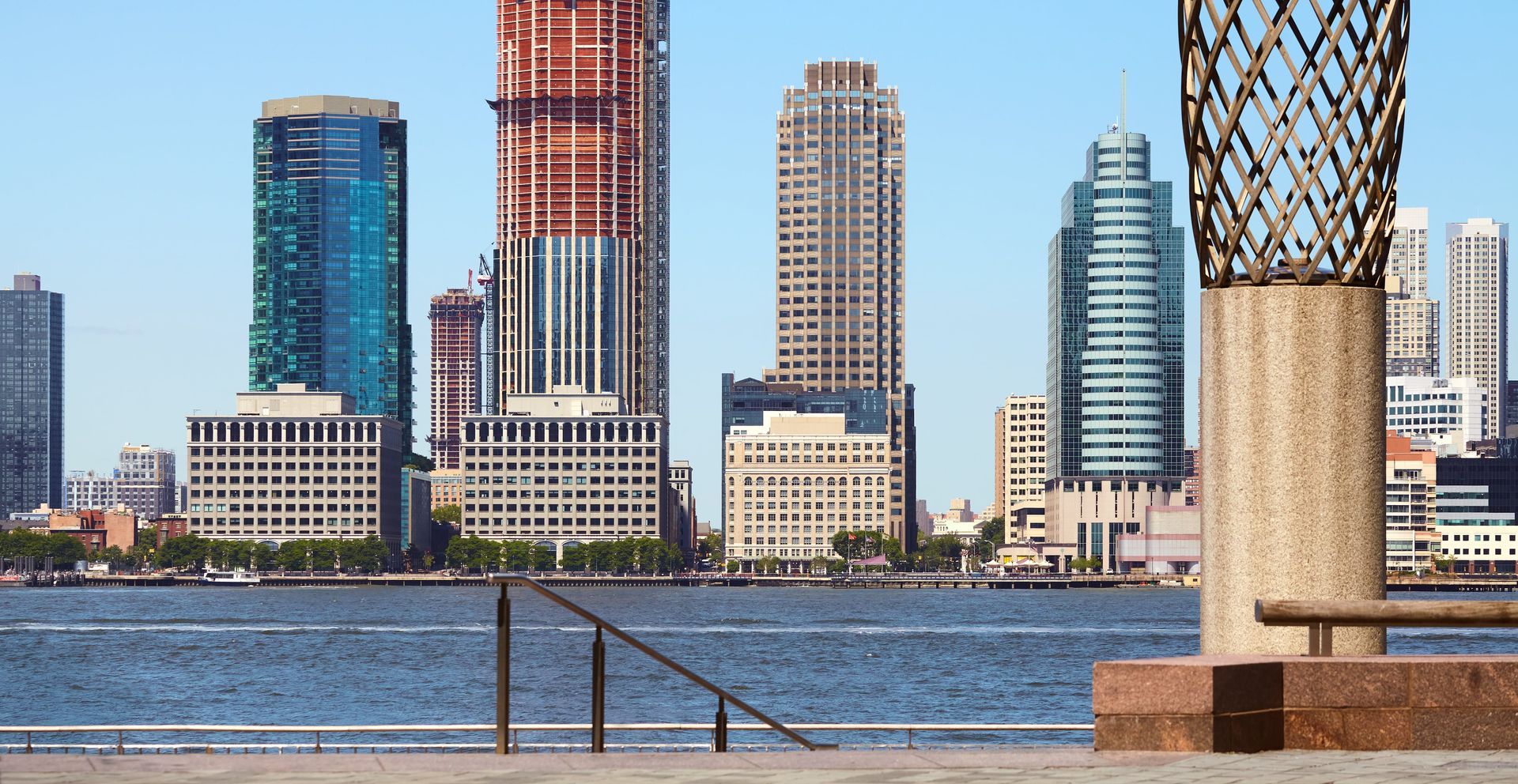New Jersey skyline with legal scales, symbolizing personal injury law representation in the state.