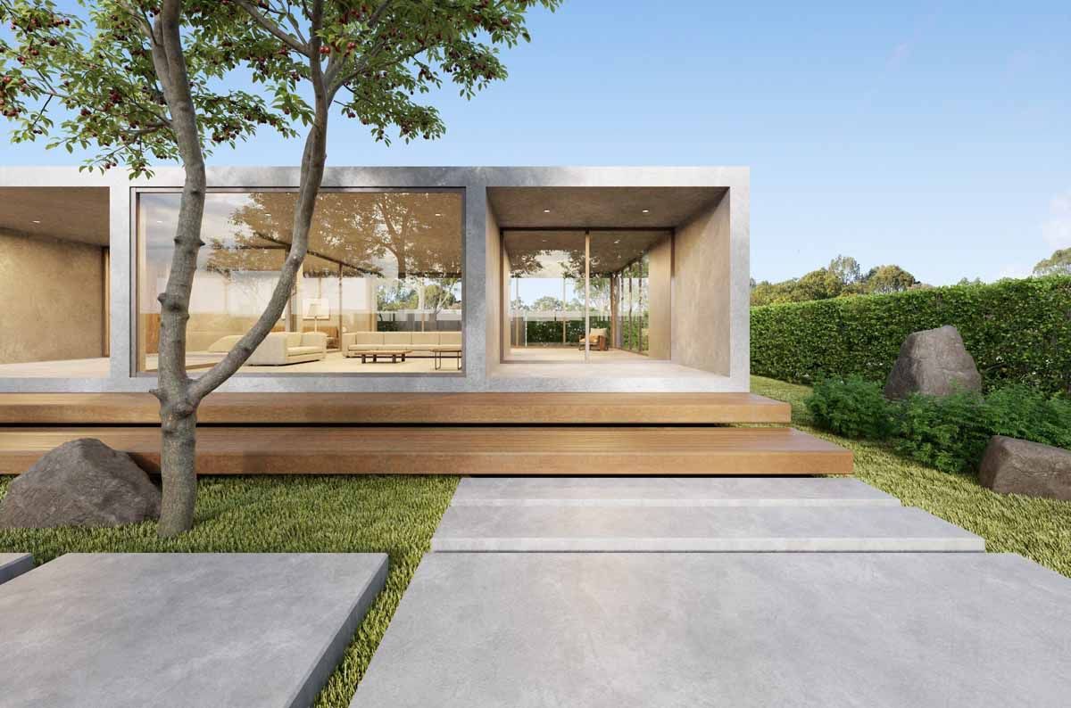 Modern minimalist house exterior with large windows, wooden deck, and concrete driveway amid greenery