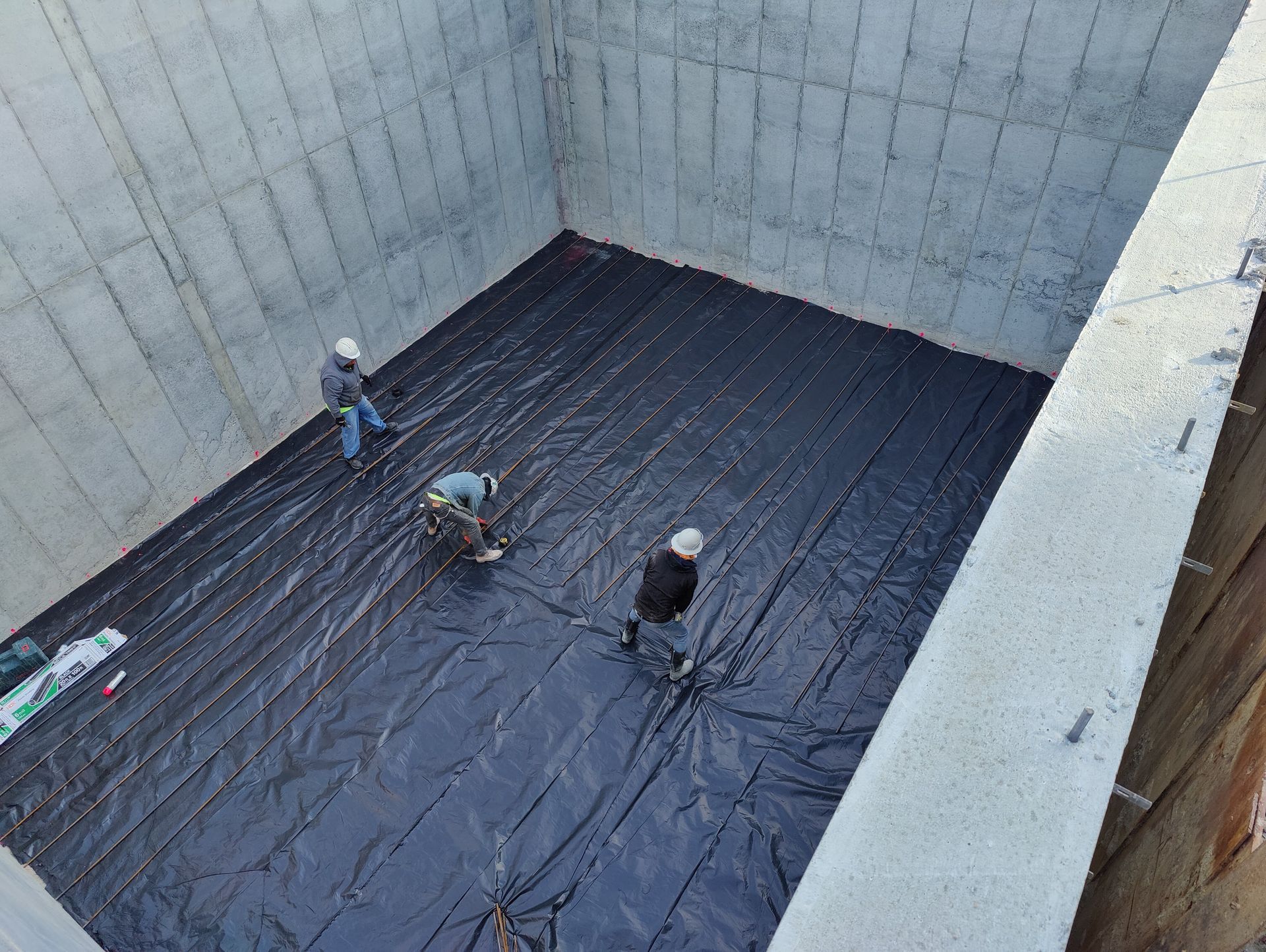 A concrete foundation is being built in a residential area.