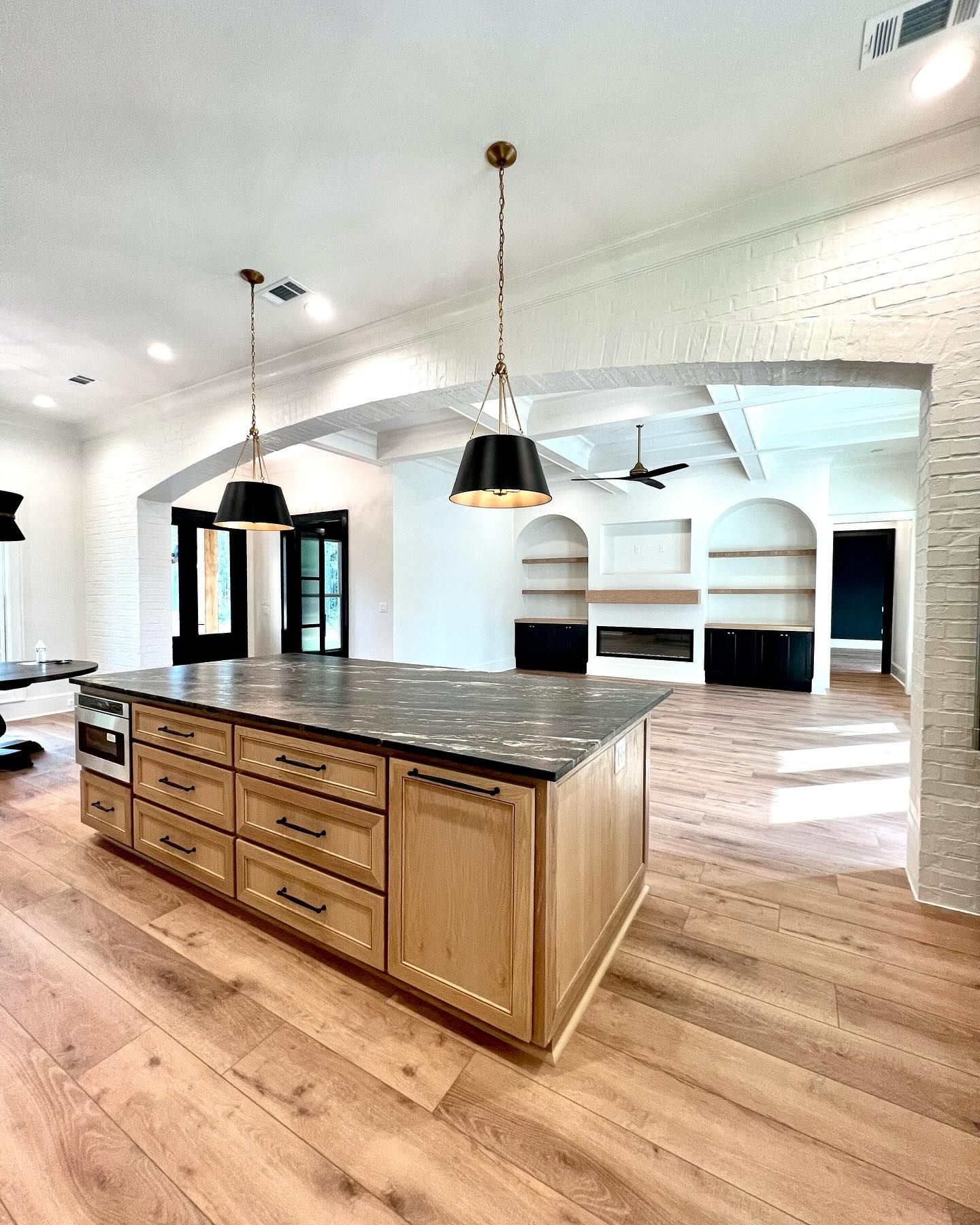 There is a large island in the middle of the kitchen.