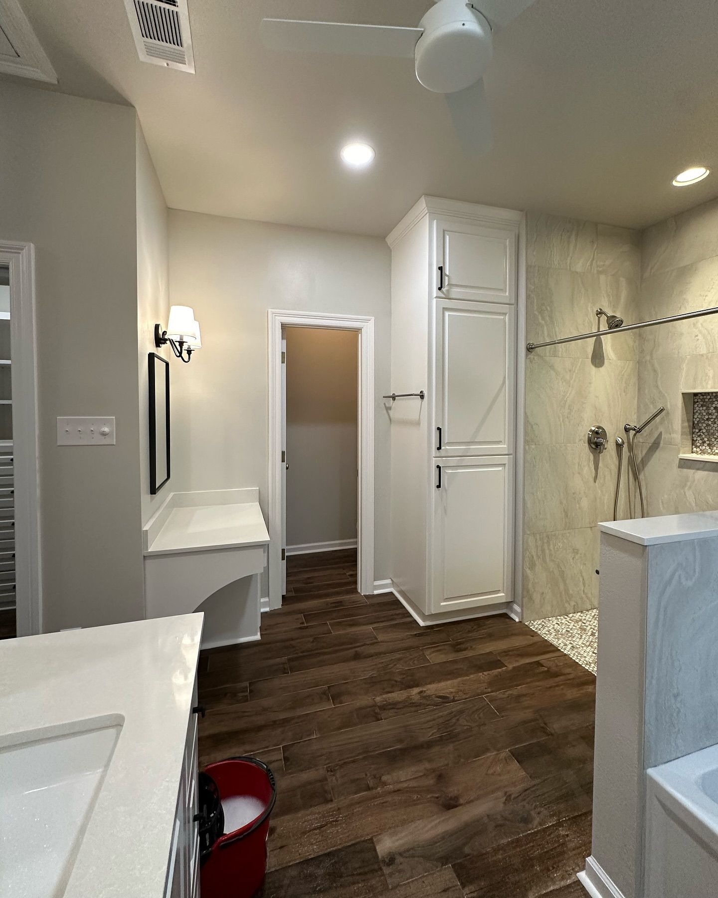 A bathroom with a sink , toilet , and shower.