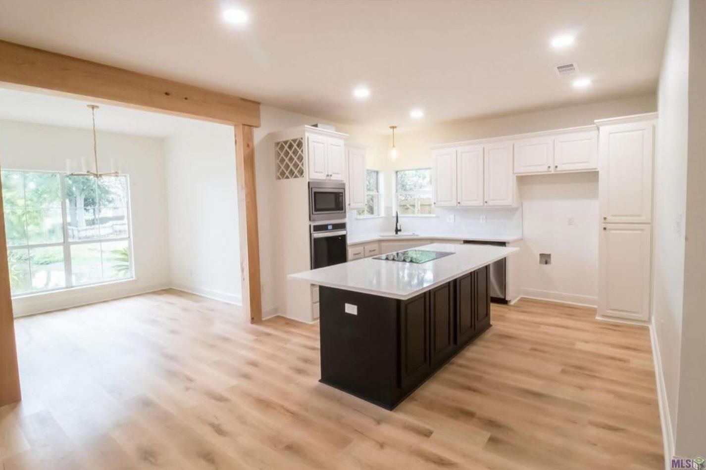 A kitchen with a large island in the middle of the room.