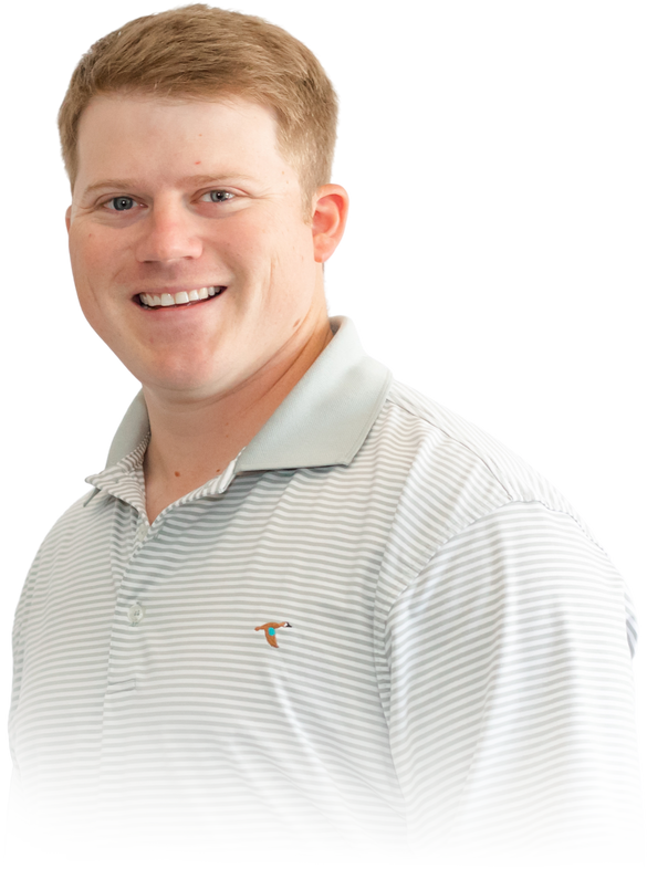 A man wearing a striped shirt with the letter t on it