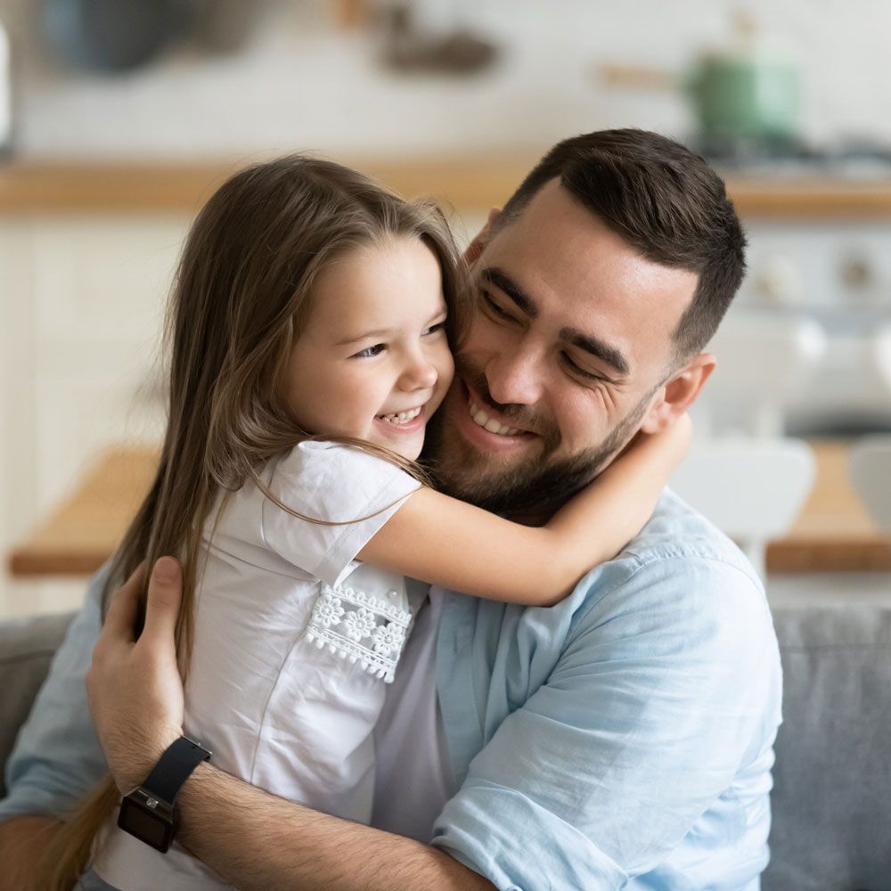 Father Hugging His Daughter — Thomasville, GA — Andrew W. Pope Law