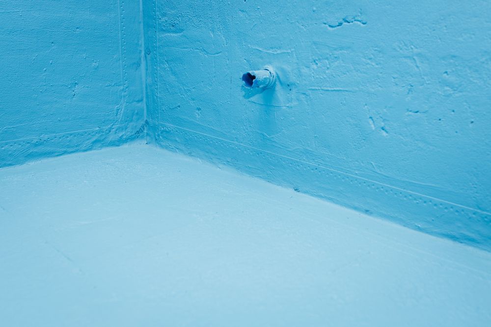 Light Blue Waterproof Sealant Used on Both Floor and Wall Surfaces — Consider It Sealed Waterproofing in Newcastle, NSW