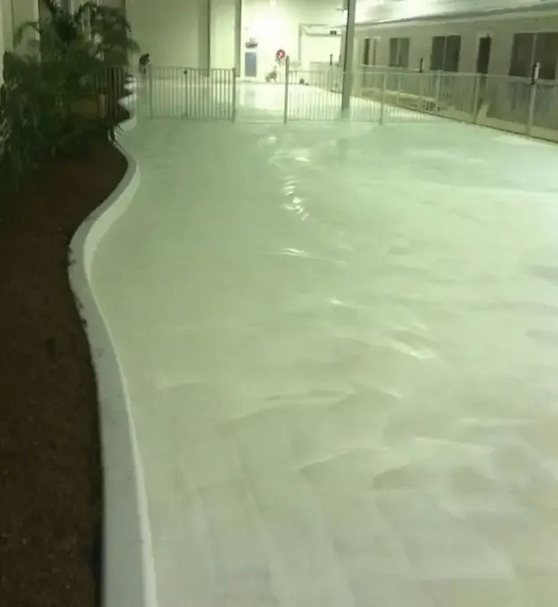 Indoor Ice Rink With a Curved White Barrier Along the Left — Consider it Sealed Waterproofing in Crangan Bay, NSW