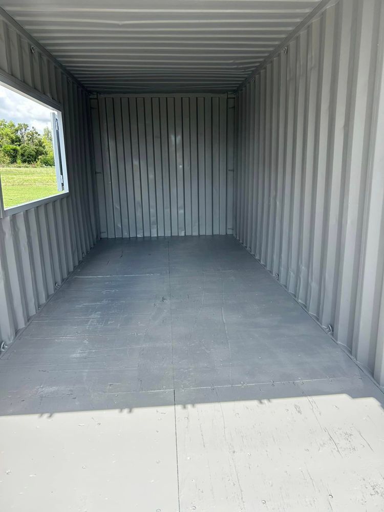 The Inside Of A Shipping Container With A Window — Ries Trucking in Gowrie Mountain, QLD