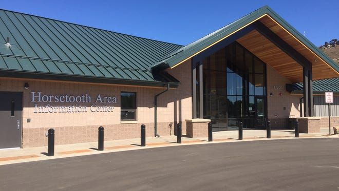 Exterior of Horseouth Area building with green roof, brick walls, and glass entrance on a sunny day