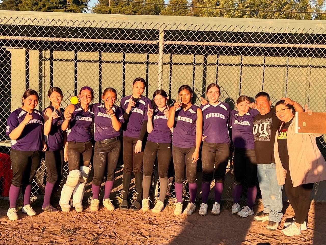 Baseball on a dark surface, with visible stitching.