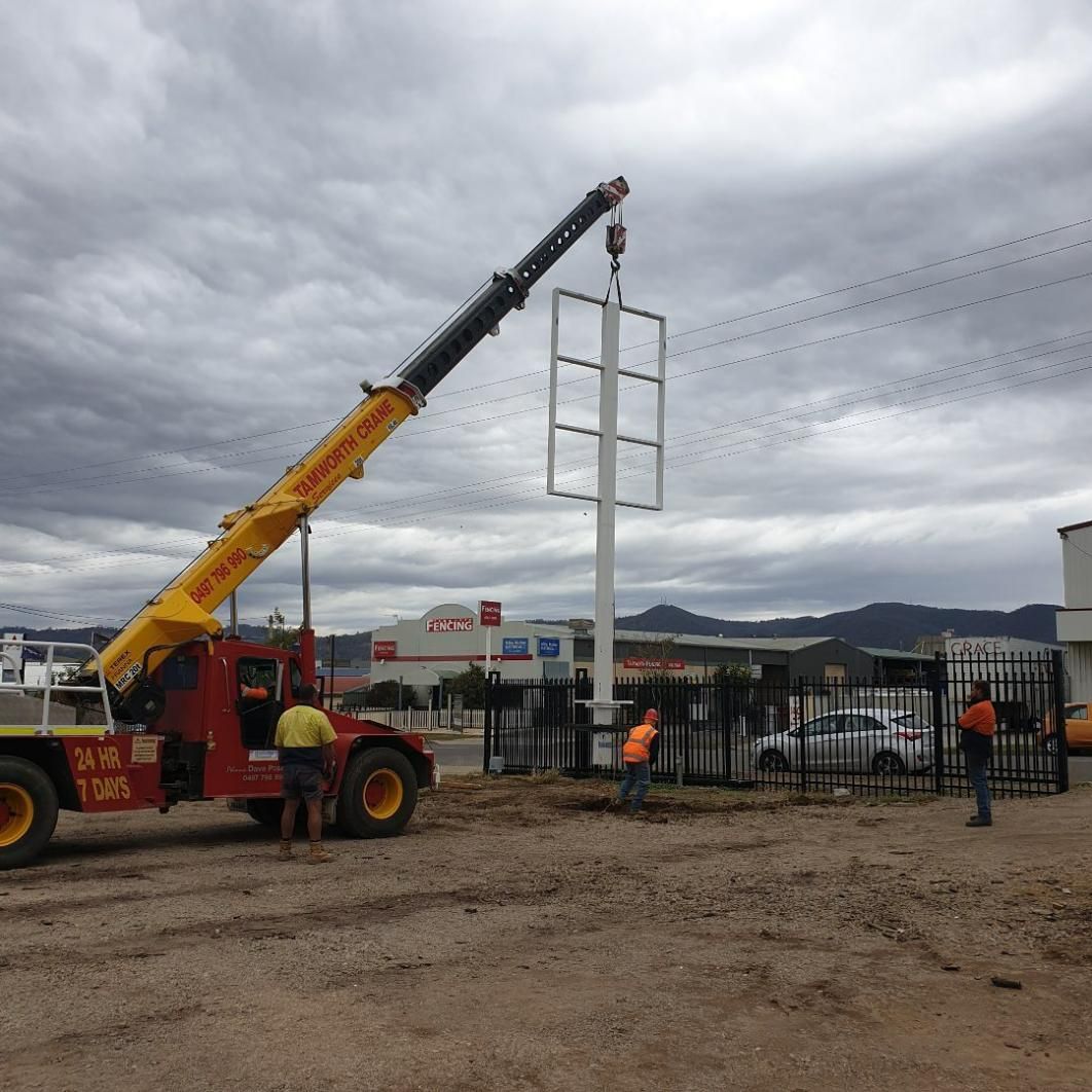 A Red Truck With A Yellow Crane On The Back Of It — Tamworth Skip Eze In Taminda, NSW
