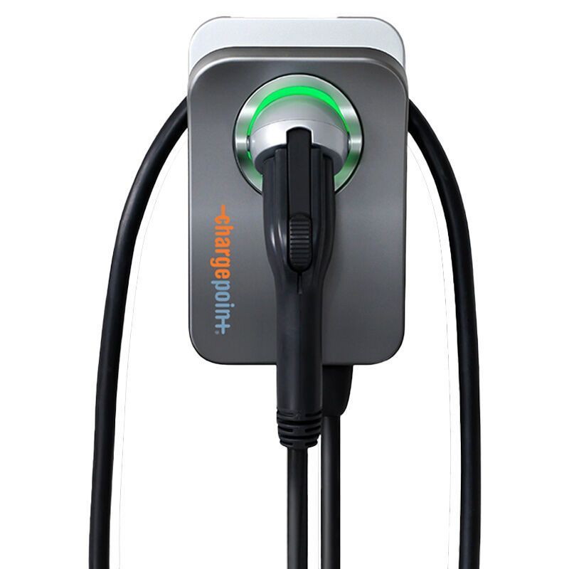 Wall-mounted EV charger with black cable and glowing green ring on a gray unit