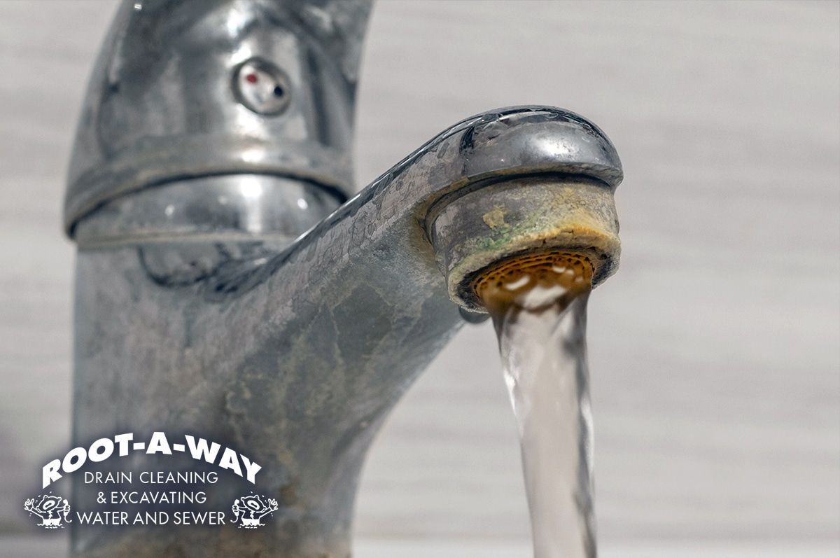 Old chrome faucet dripping water