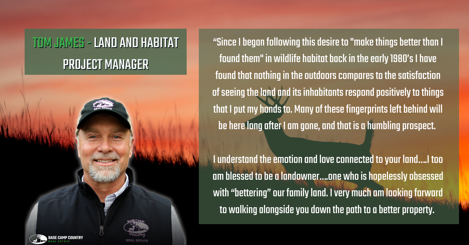 A man with a beard is wearing a hat and vest.