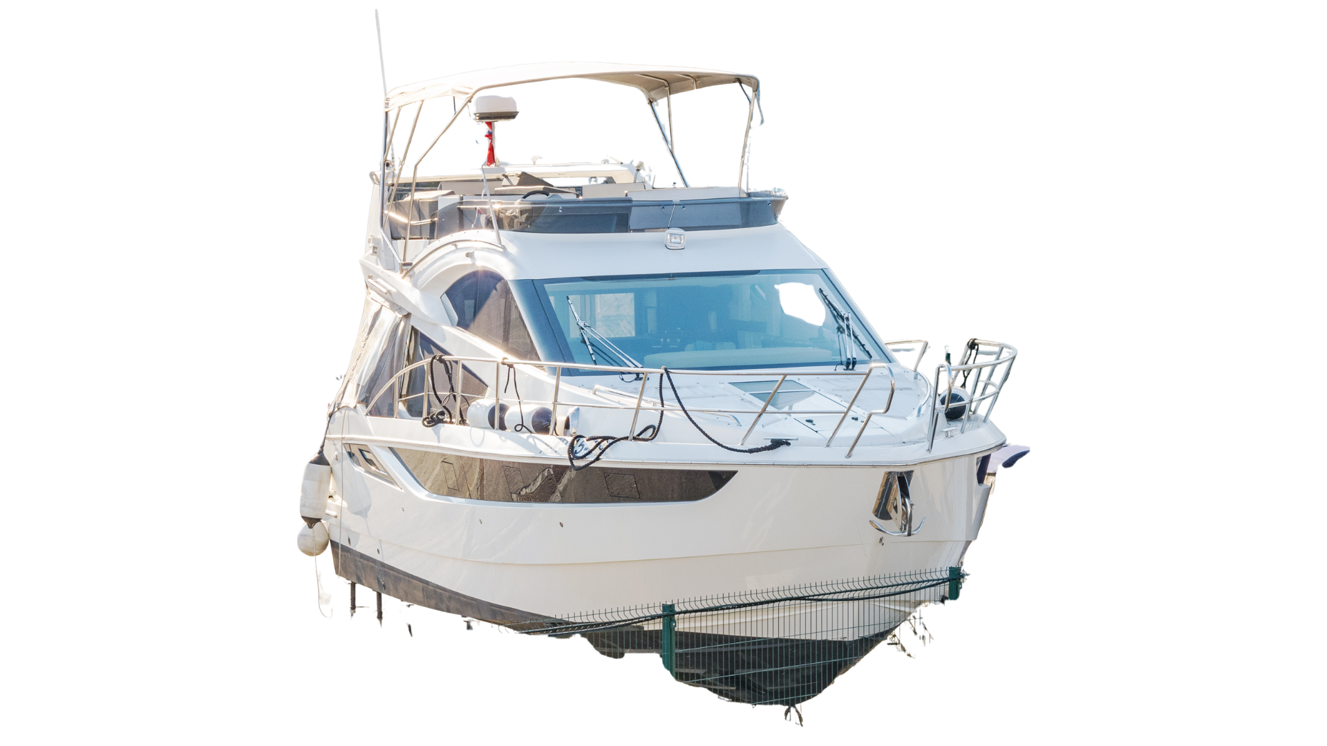 White motor yacht with radar, canopy, and railings, isolated on white background.