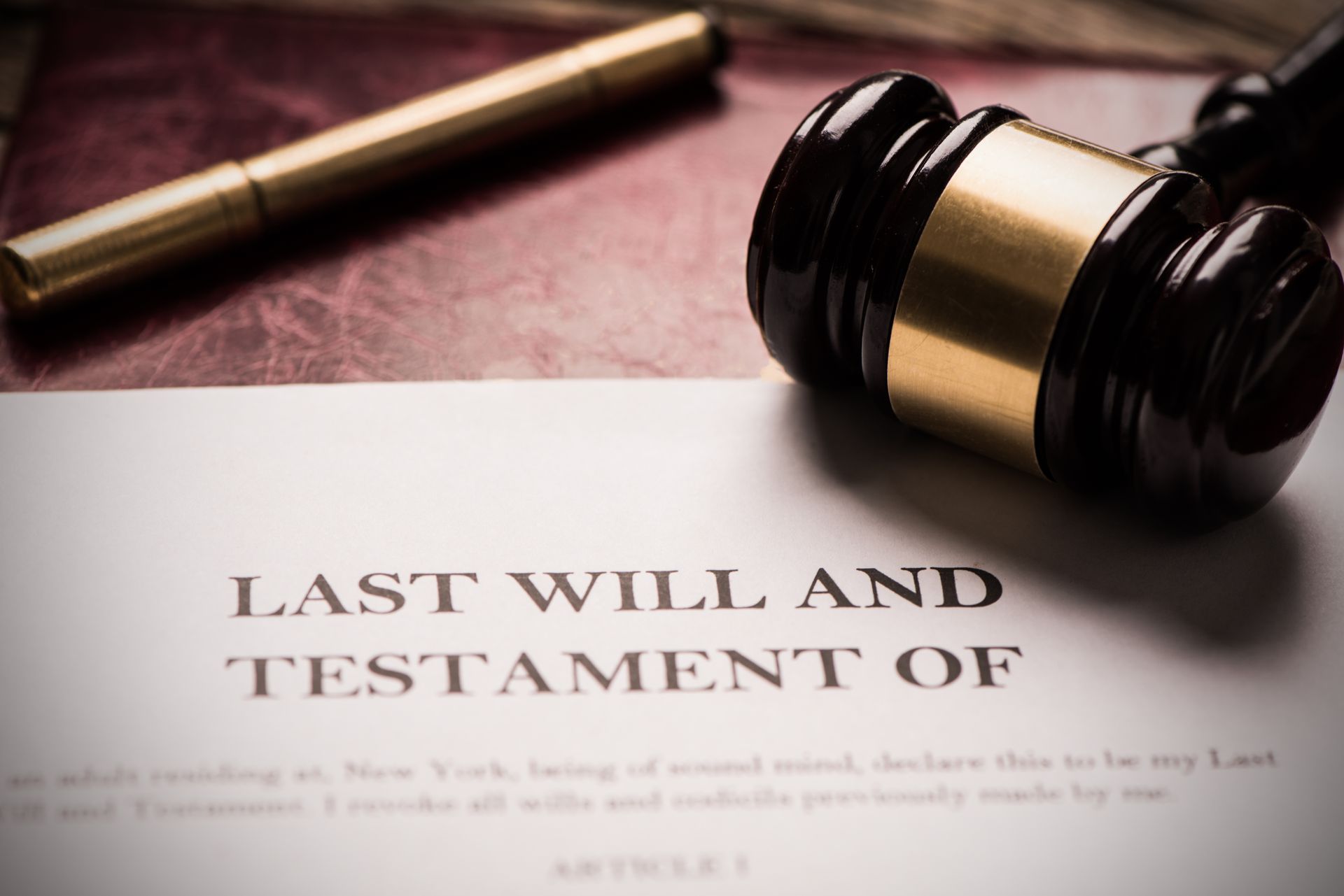 Estate Planning Attorney reviews Last Will and Testament document on a desk