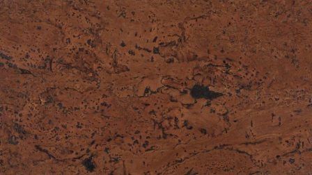 A close up of a piece of brown cork flooring.