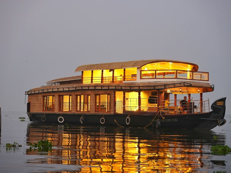 Traditional Kerala houseboat cruising on the backwaters of Alleppey, India