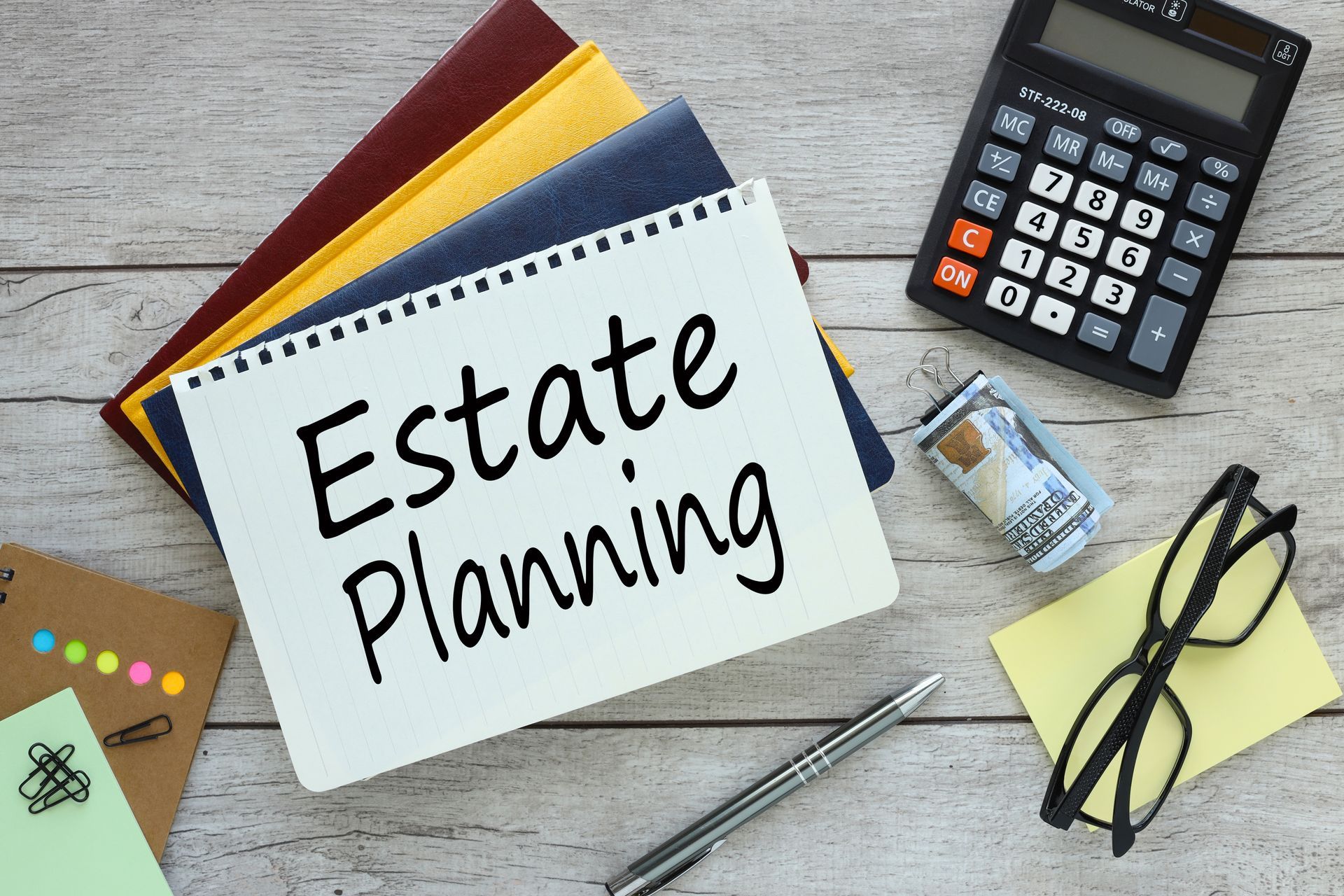 a notebook with the words `` estate planning '' written on it .