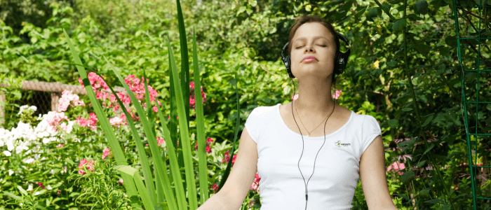 A woman practicing effective mindful movements with an online instructor