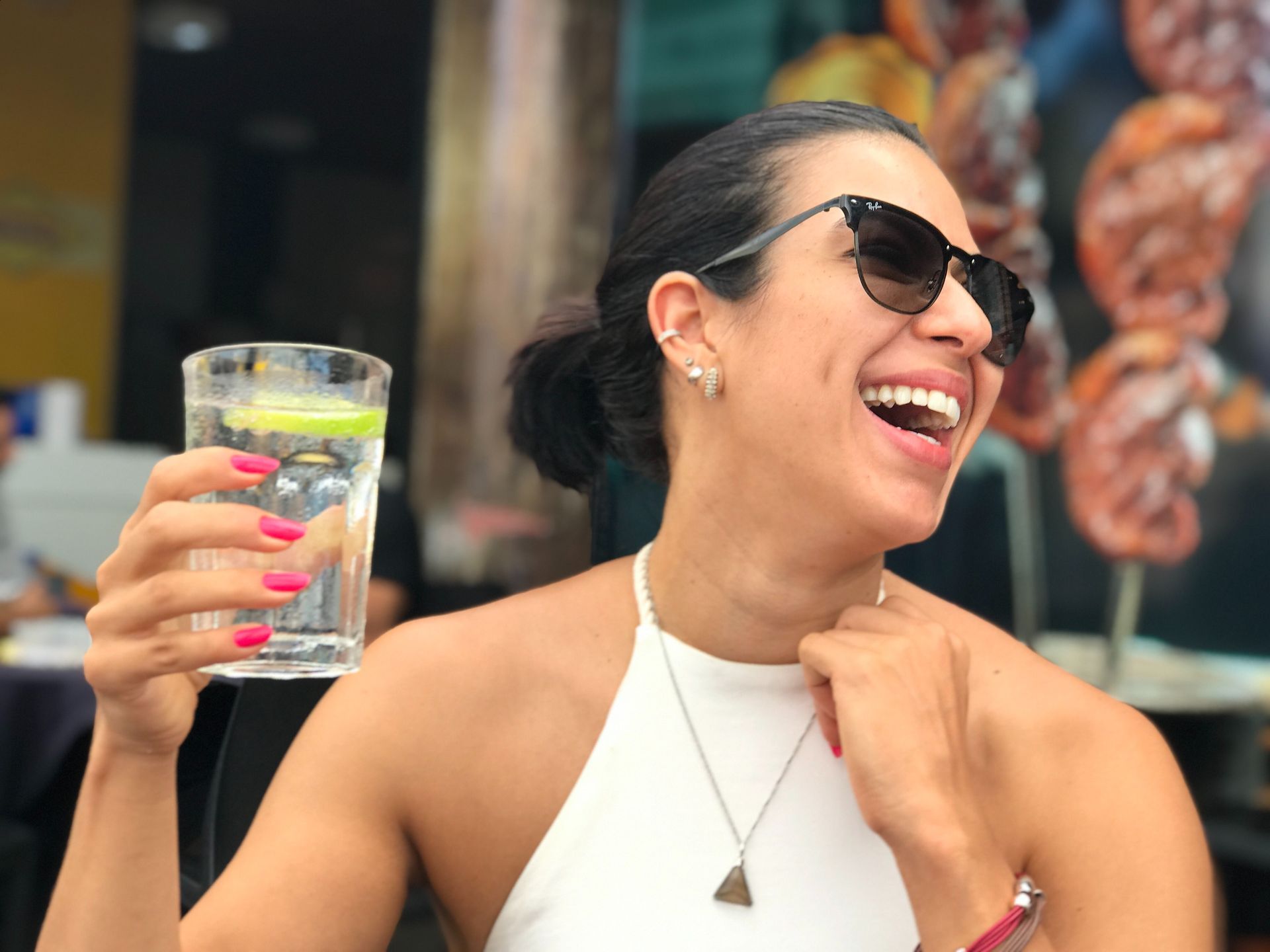 A happy woman staying hydrated