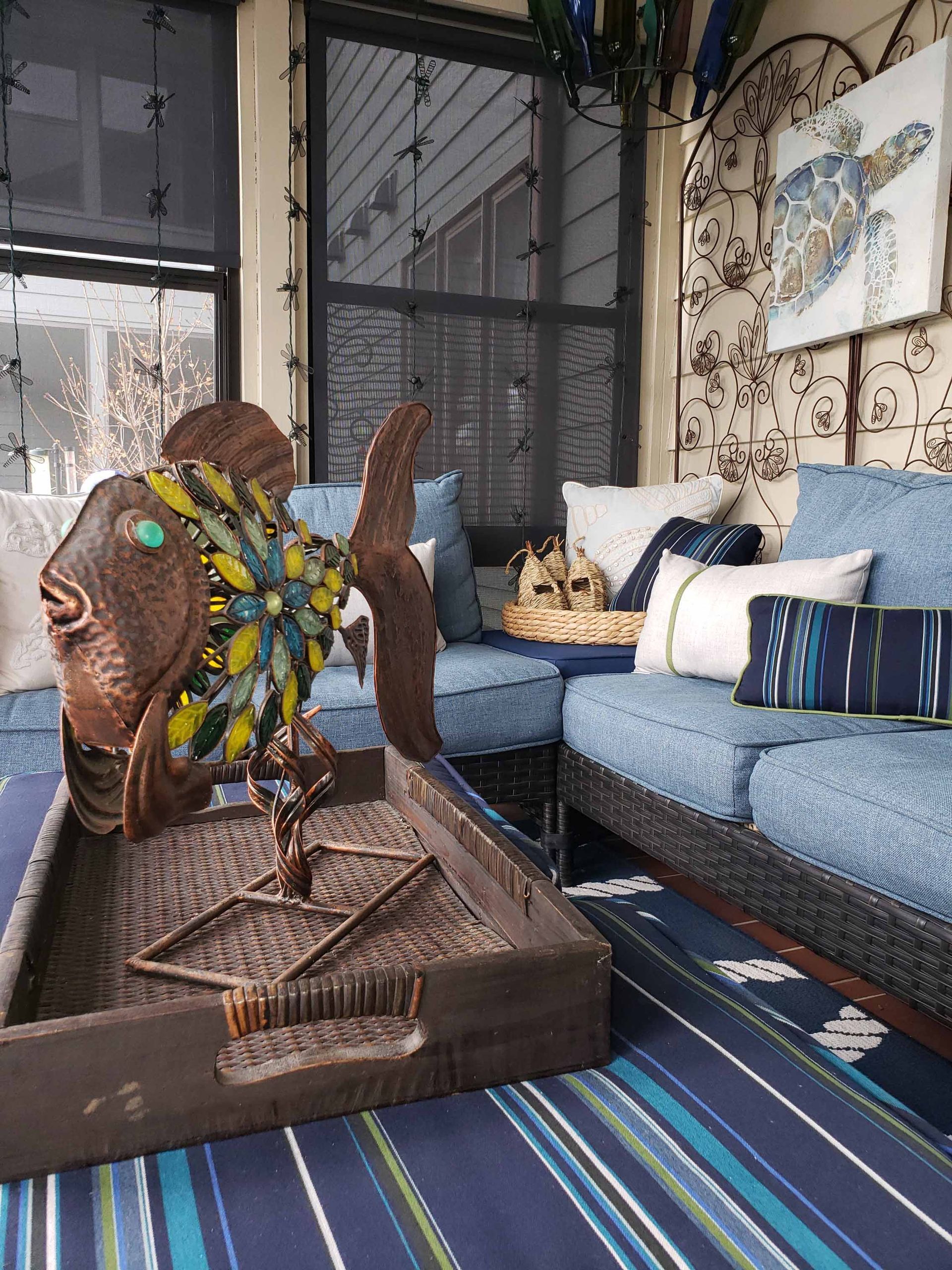 A living room with a couch and a tray on the floor.