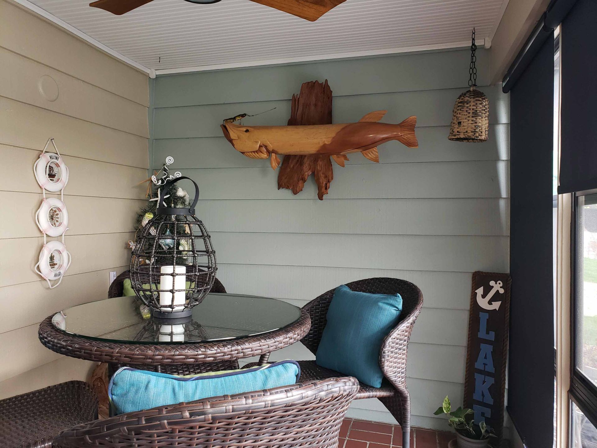A room with a table and chairs and a sign that says lake