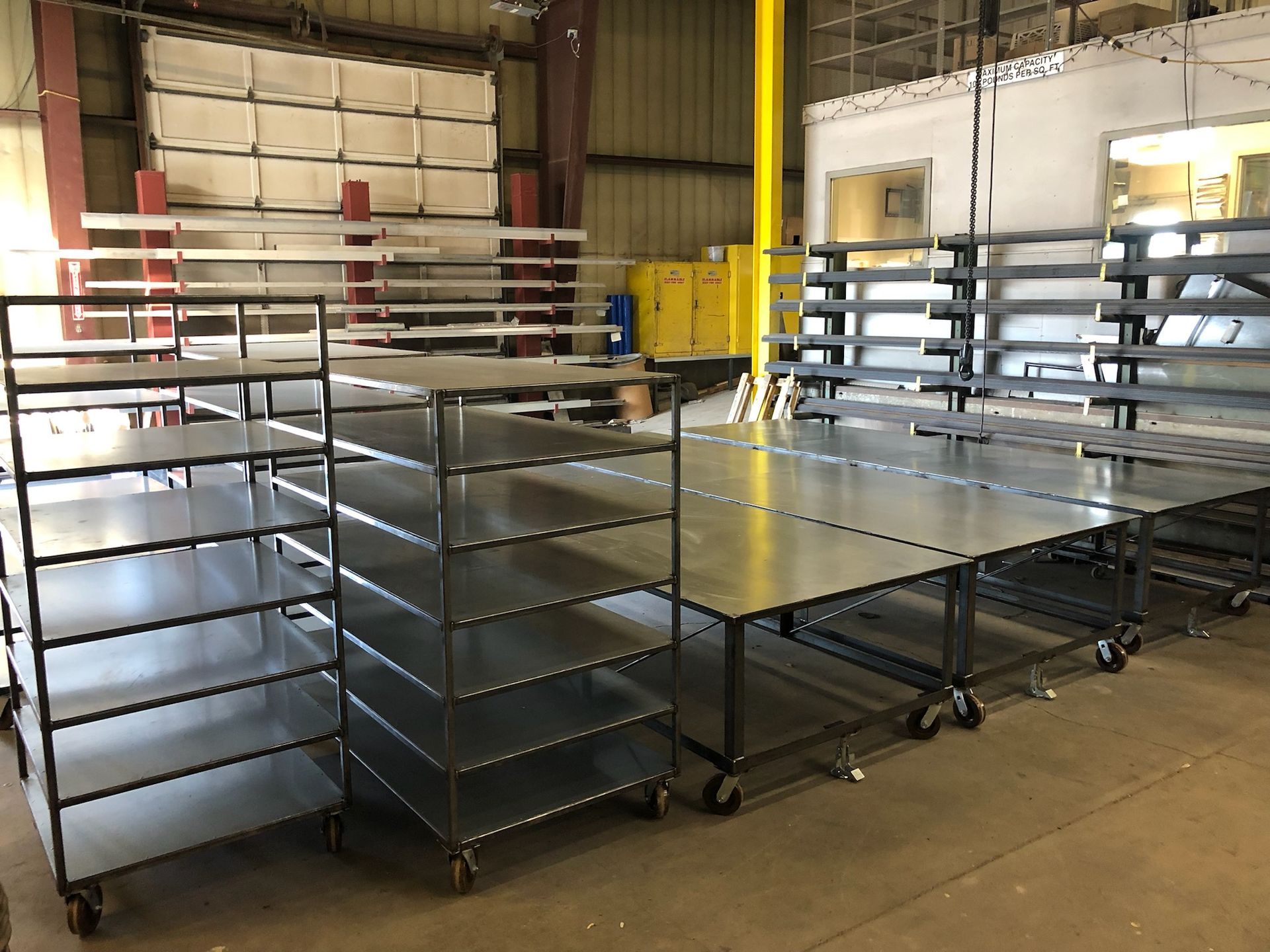 A warehouse filled with lots of shelves and carts