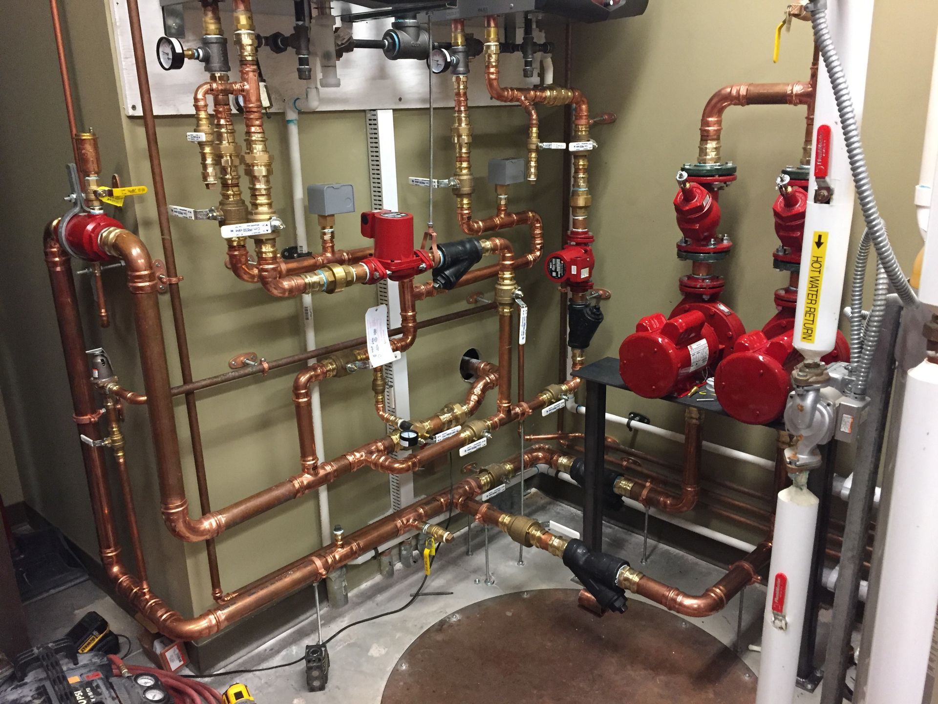 A room filled with lots of copper pipes and valves.