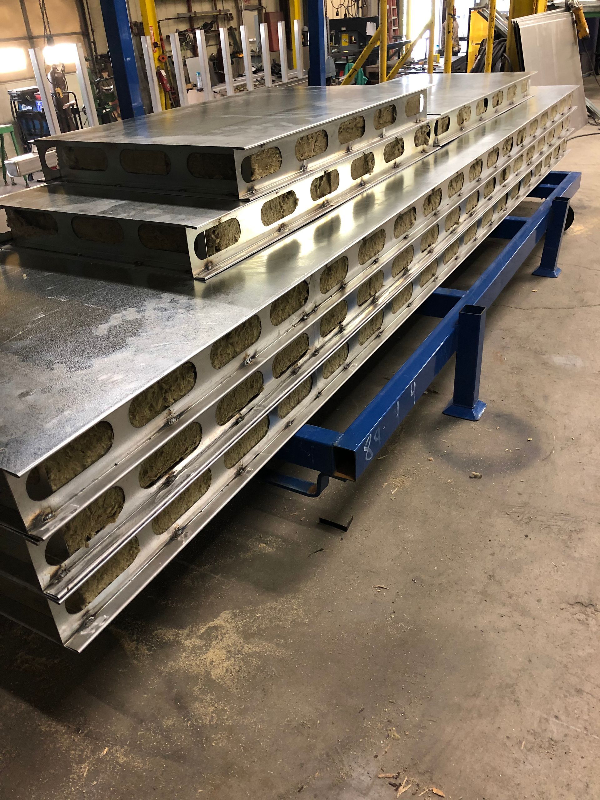 A stack of metal plates sitting on top of each other in a factory.