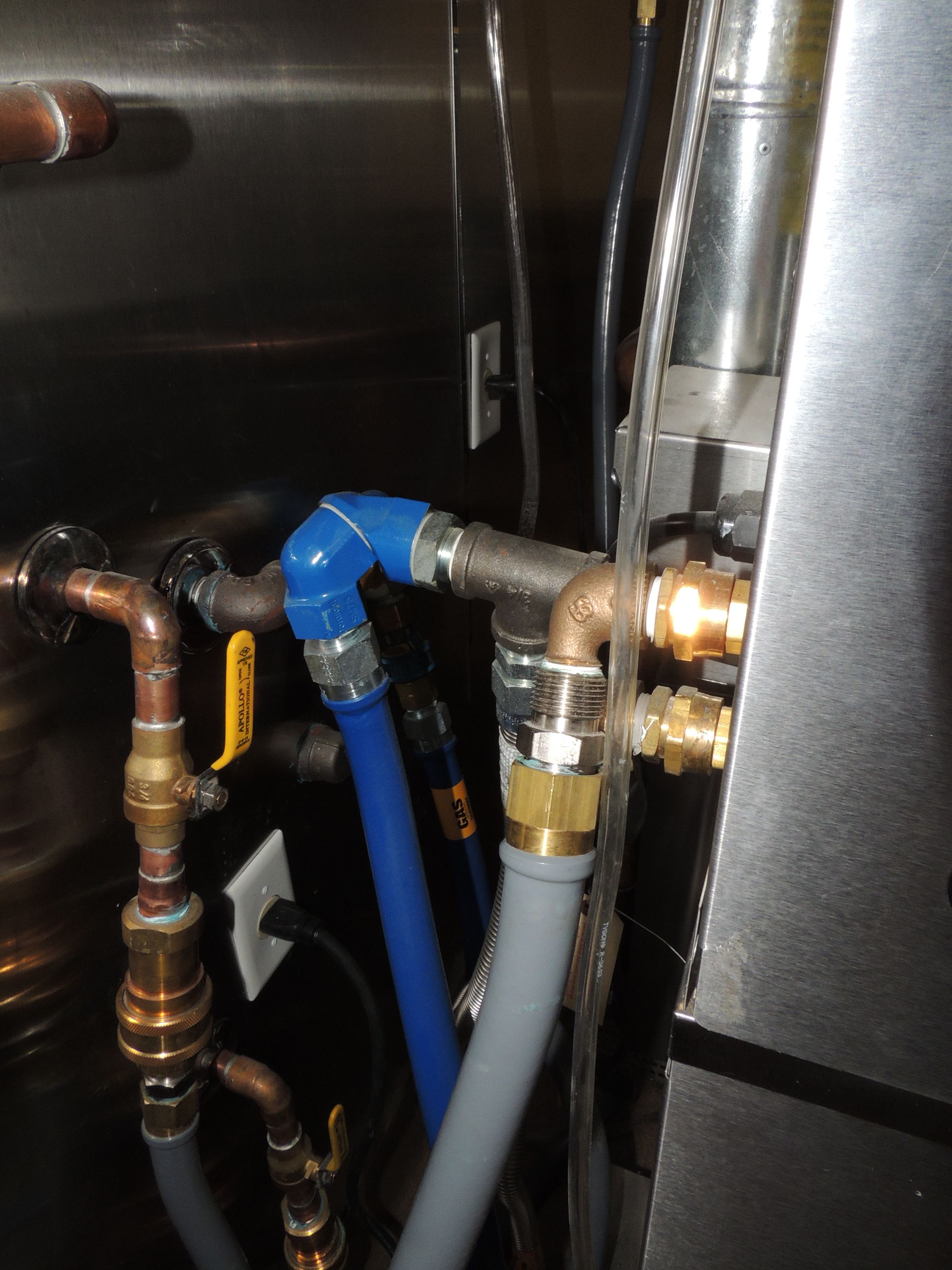 A blue hose is connected to a yellow valve