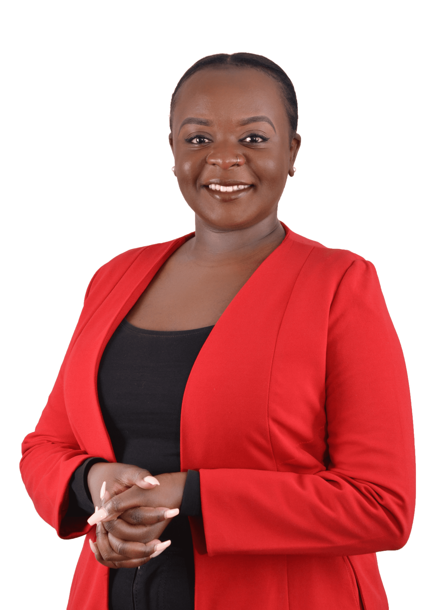 Woman with short dark hair wearing a red blazer over a black top, hands clasped, smiling.