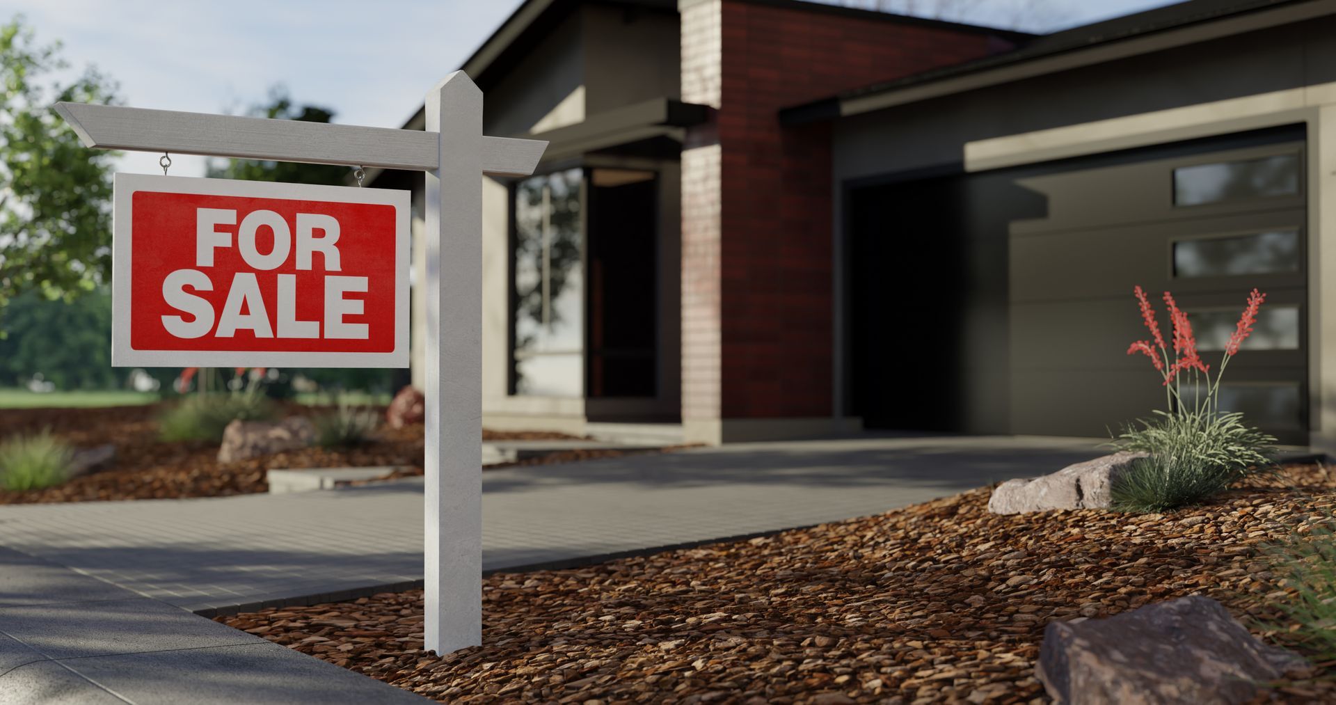 Red for sale sign in front of a modern house with a garage and driveway