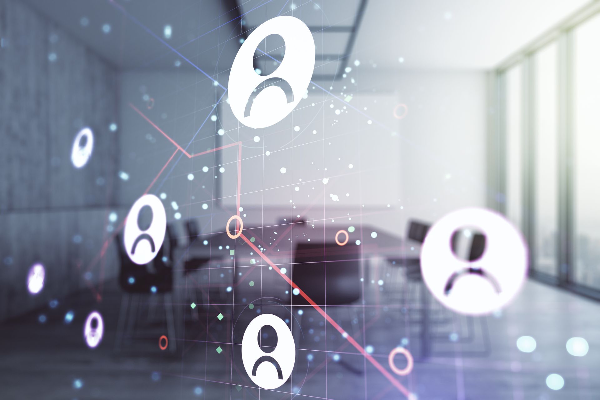 A blurred image of a conference room with icons of people floating in the air.