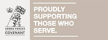 A sign that says `` proudly supporting those who serve ''