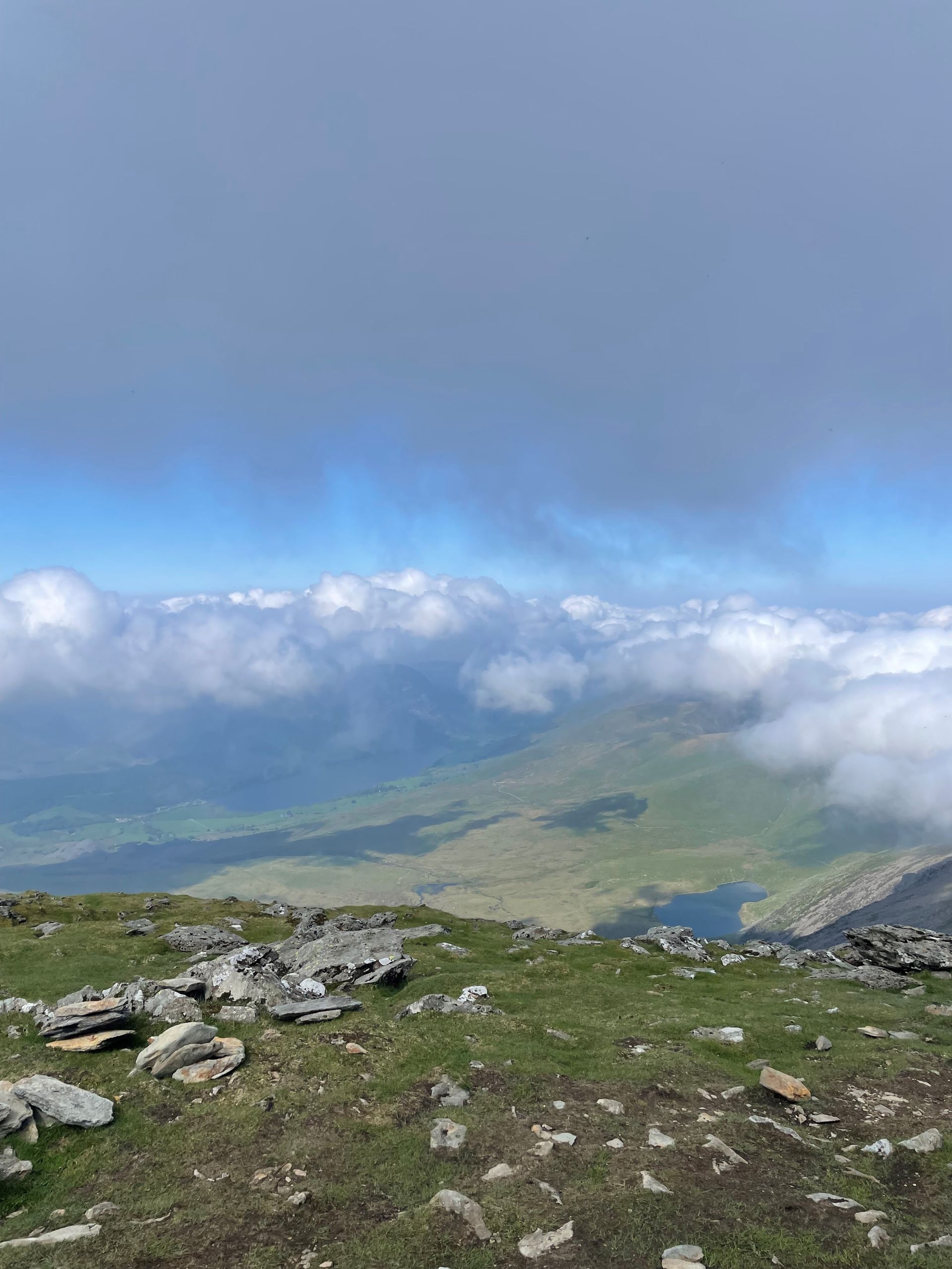 A view of a valley from the top of a mountain.