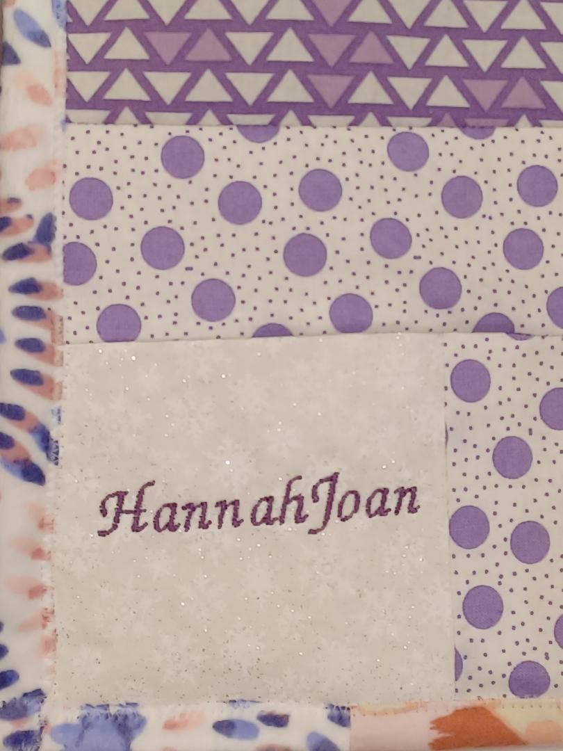 Purple patterned notebook cover with a white label reading “HannahJoan”