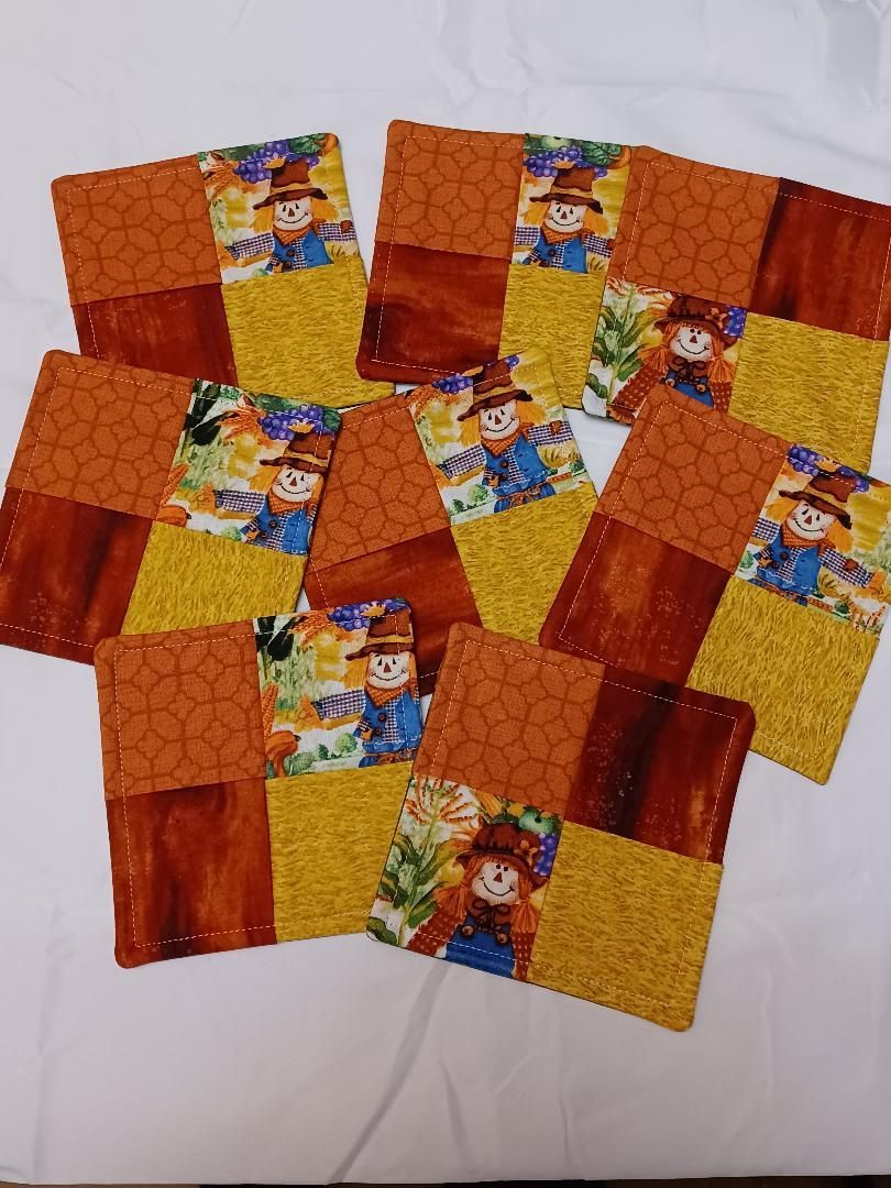 A stack of colorful children’s puzzle cards with cartoon characters, mostly orange, red, and yellow.