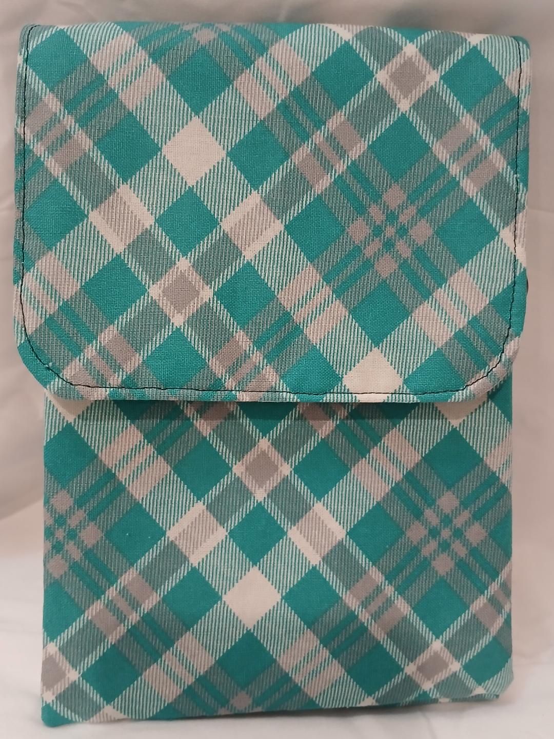 Two teal-and-beige plaid fabric pouches stacked one on top of the other