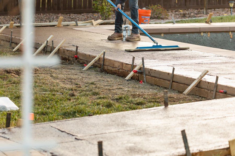 worker using concrete trowel
