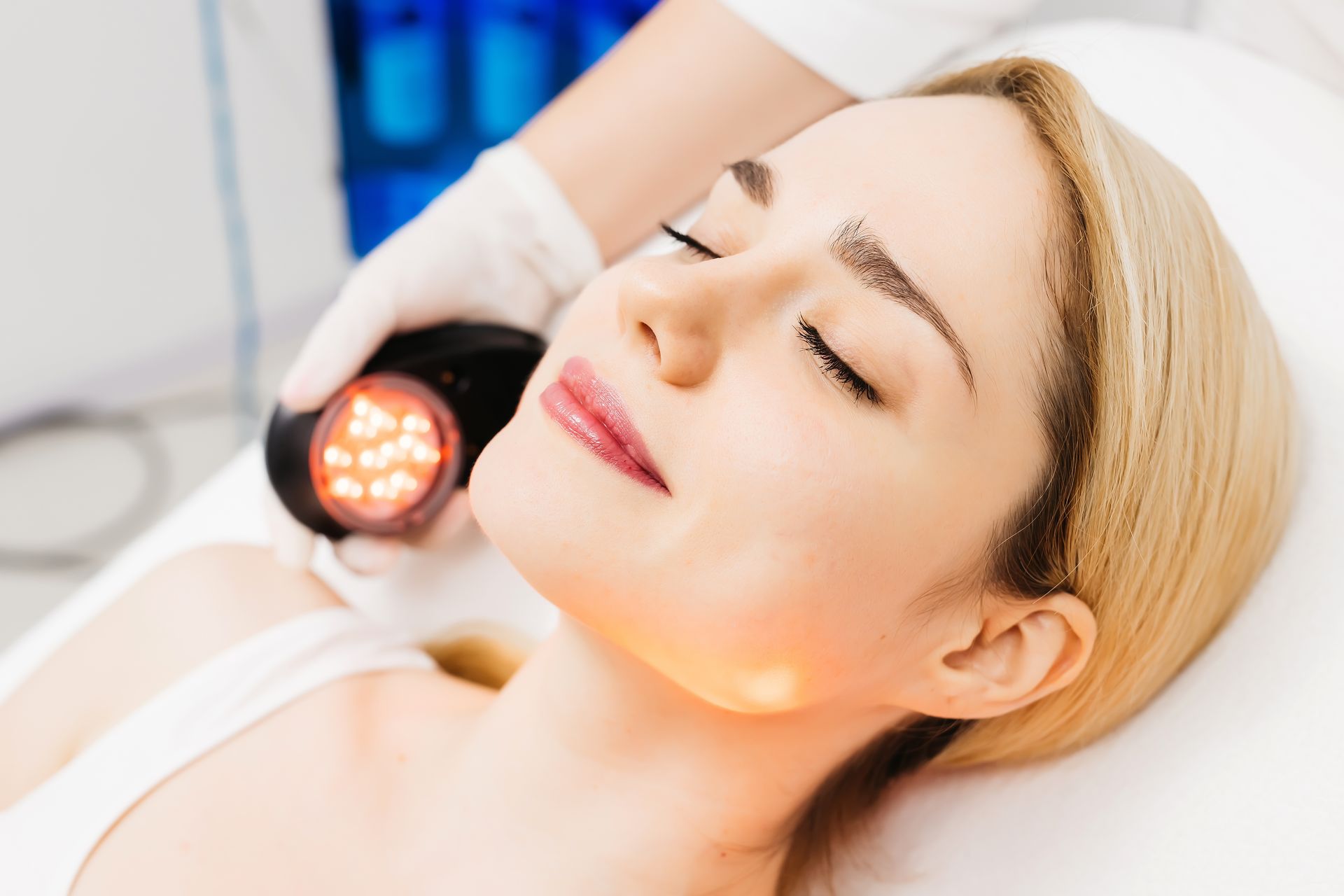 A woman is getting her eyebrows done by a doctor.