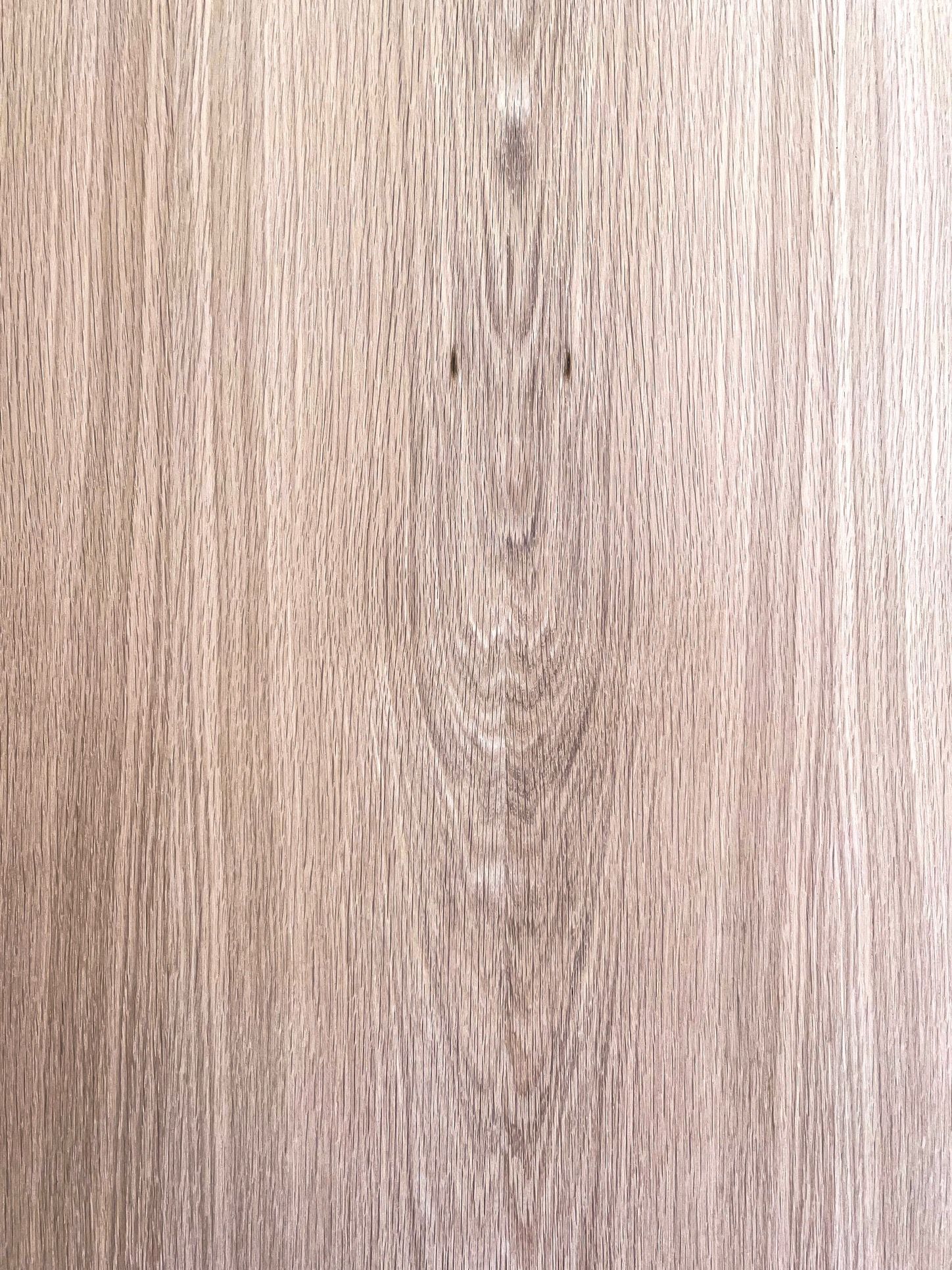A close up of a piece of wood showing the grain and texture.