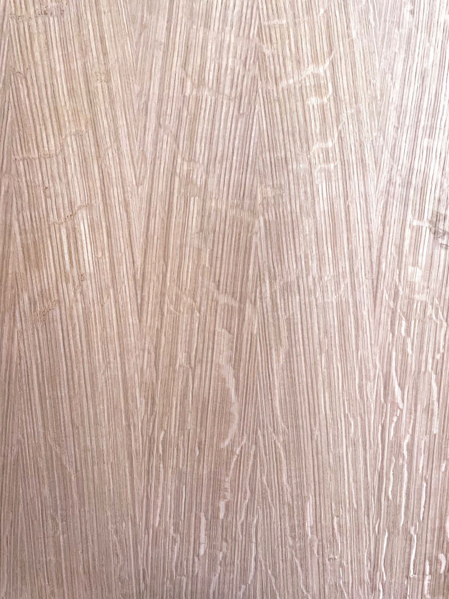 A close up of a piece of wood showing the texture of the wood.