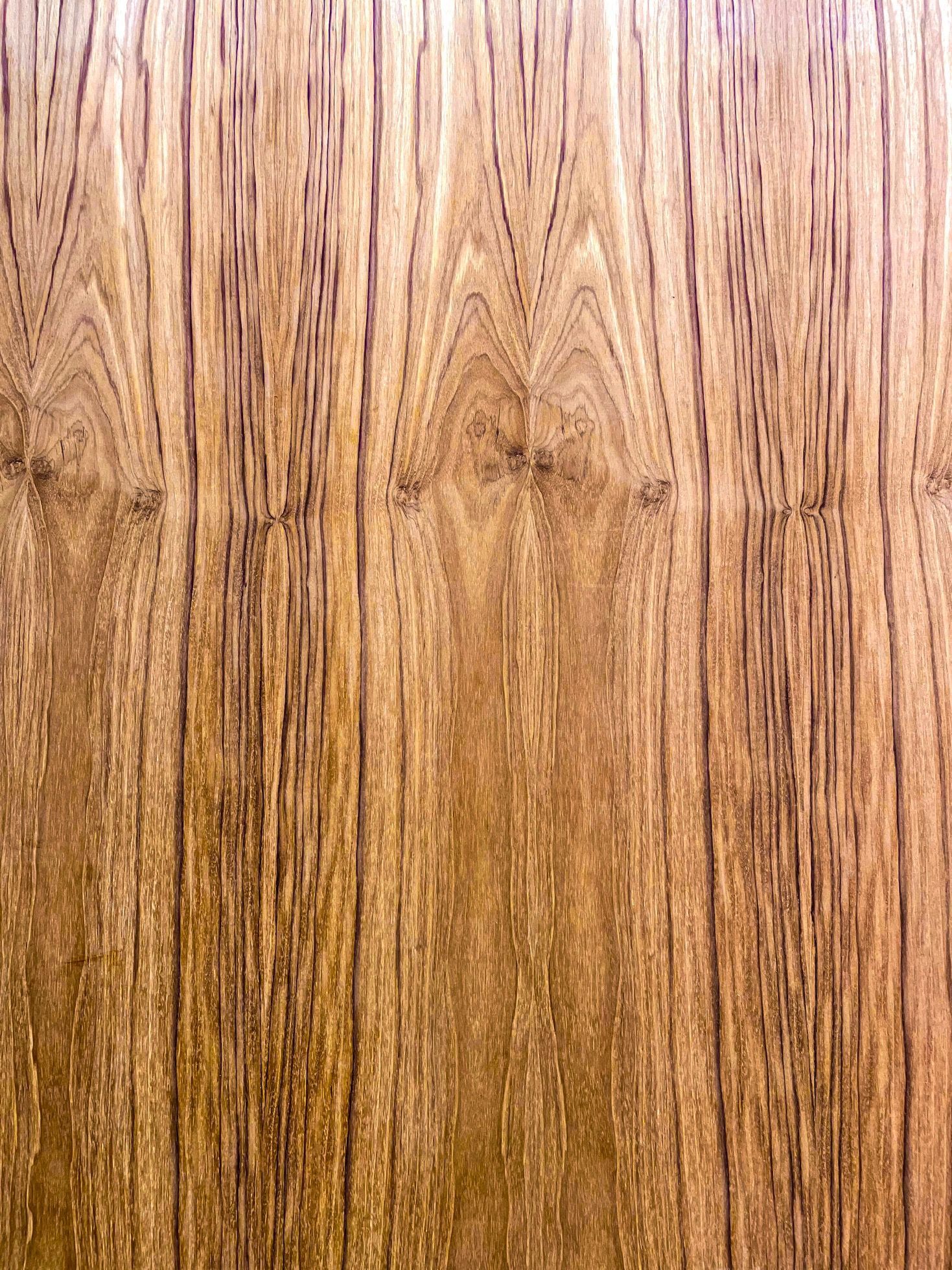 A close up of a piece of wood showing the grain and texture.
