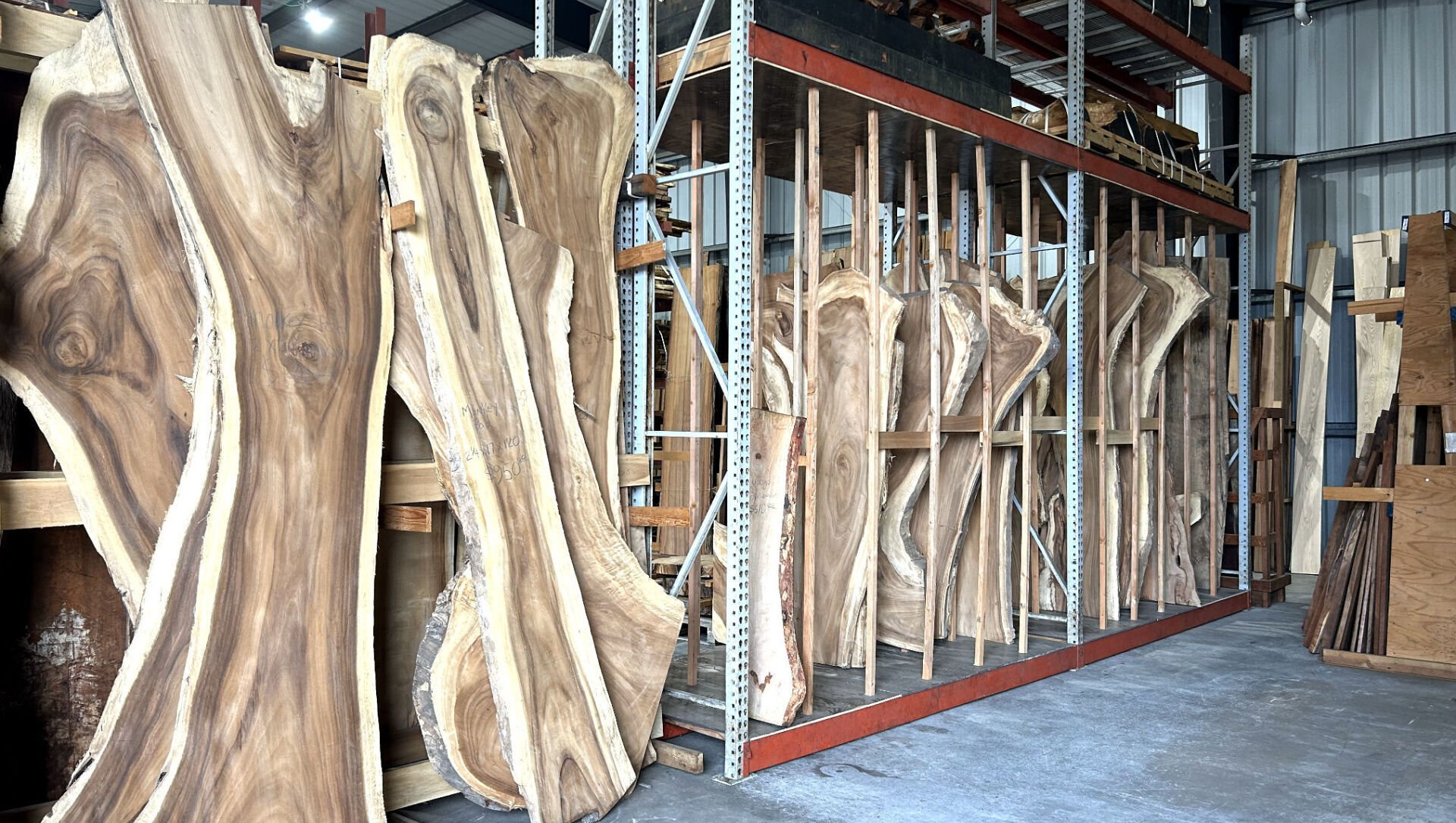 A warehouse filled with lots of wooden pieces.