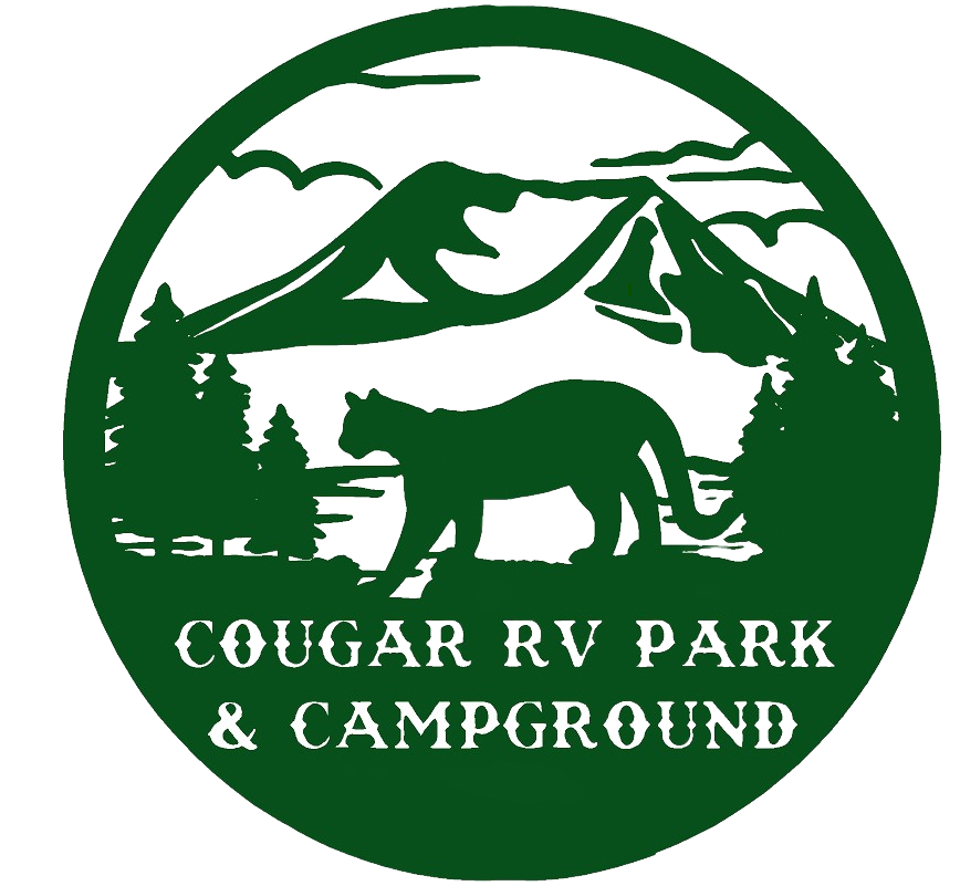 Green logo for Cougar RV Park & Campground with mountain, trees, and cougar silhouette