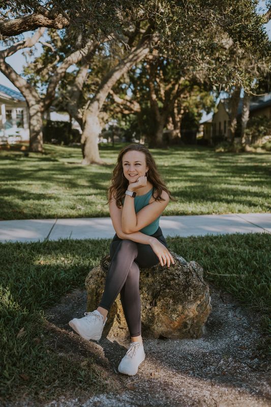 Photo of Lauren Bauer sitting in  park